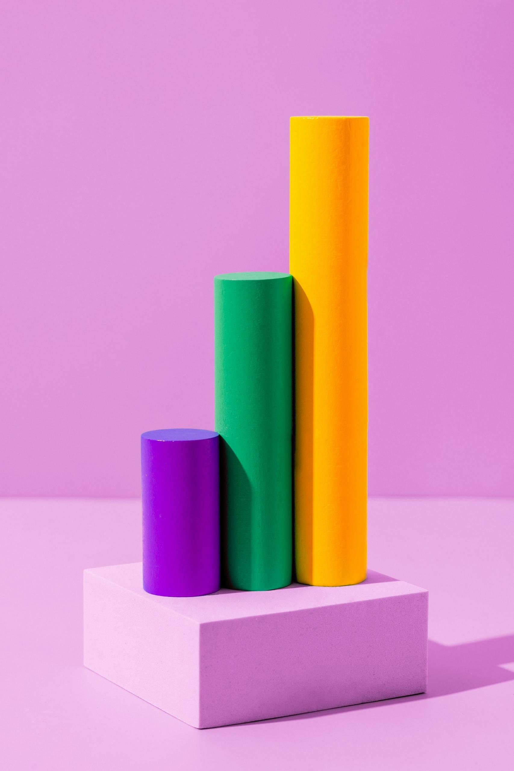 Three cylindrical blocks standing on end next to each other.