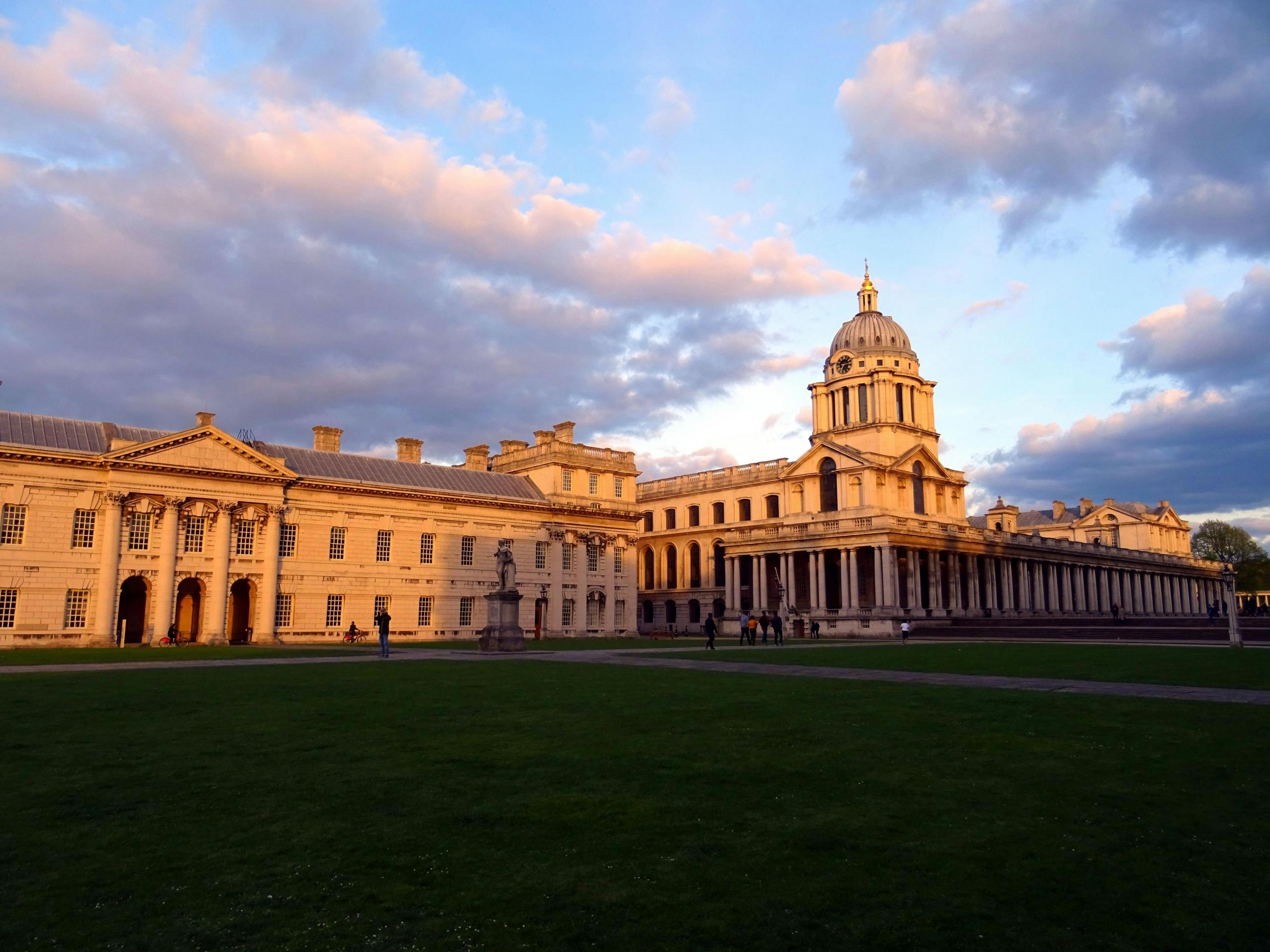 University buildings in London surrounded by greenery under a clear sky.