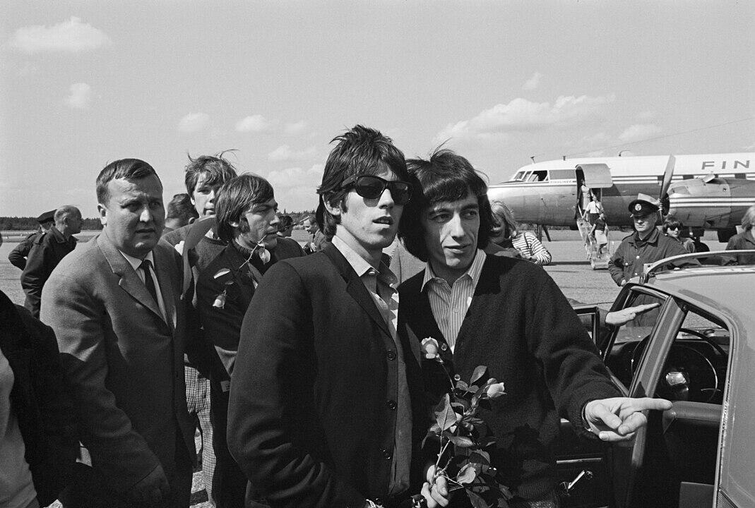 The members of the Rolling Stones on an airport runway