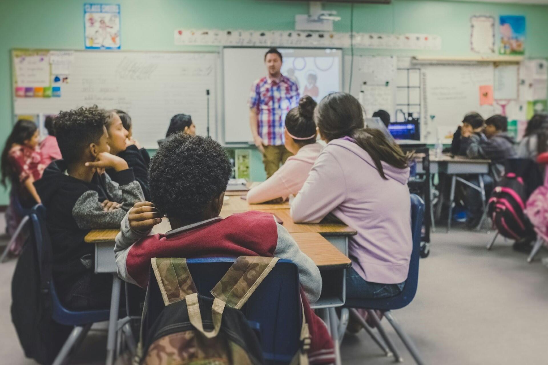 A teacher in a classroom.