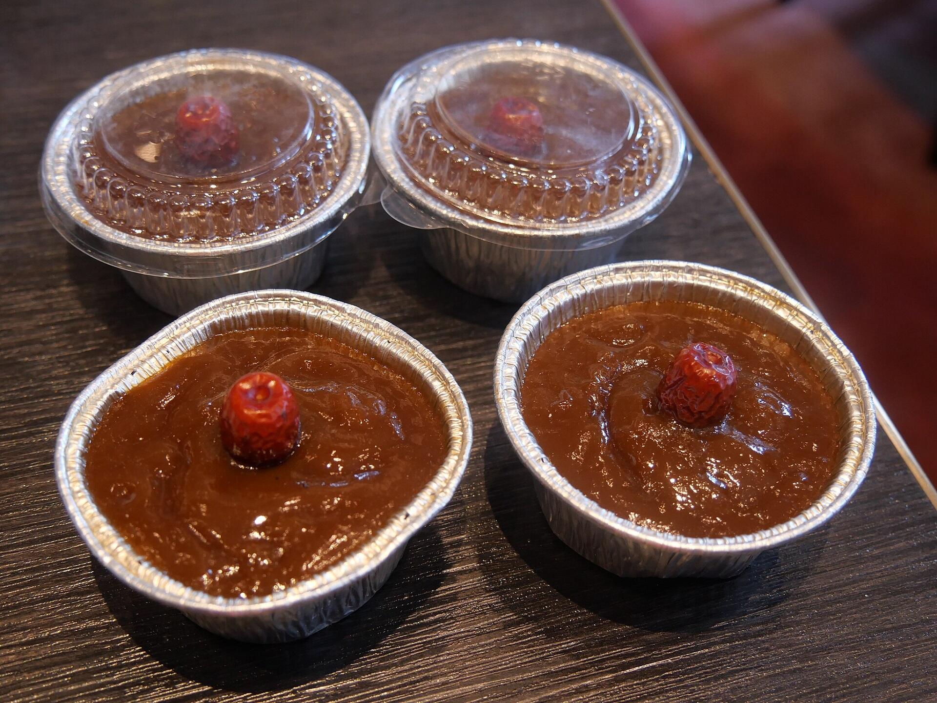 Four mini-cakes in foil pans.