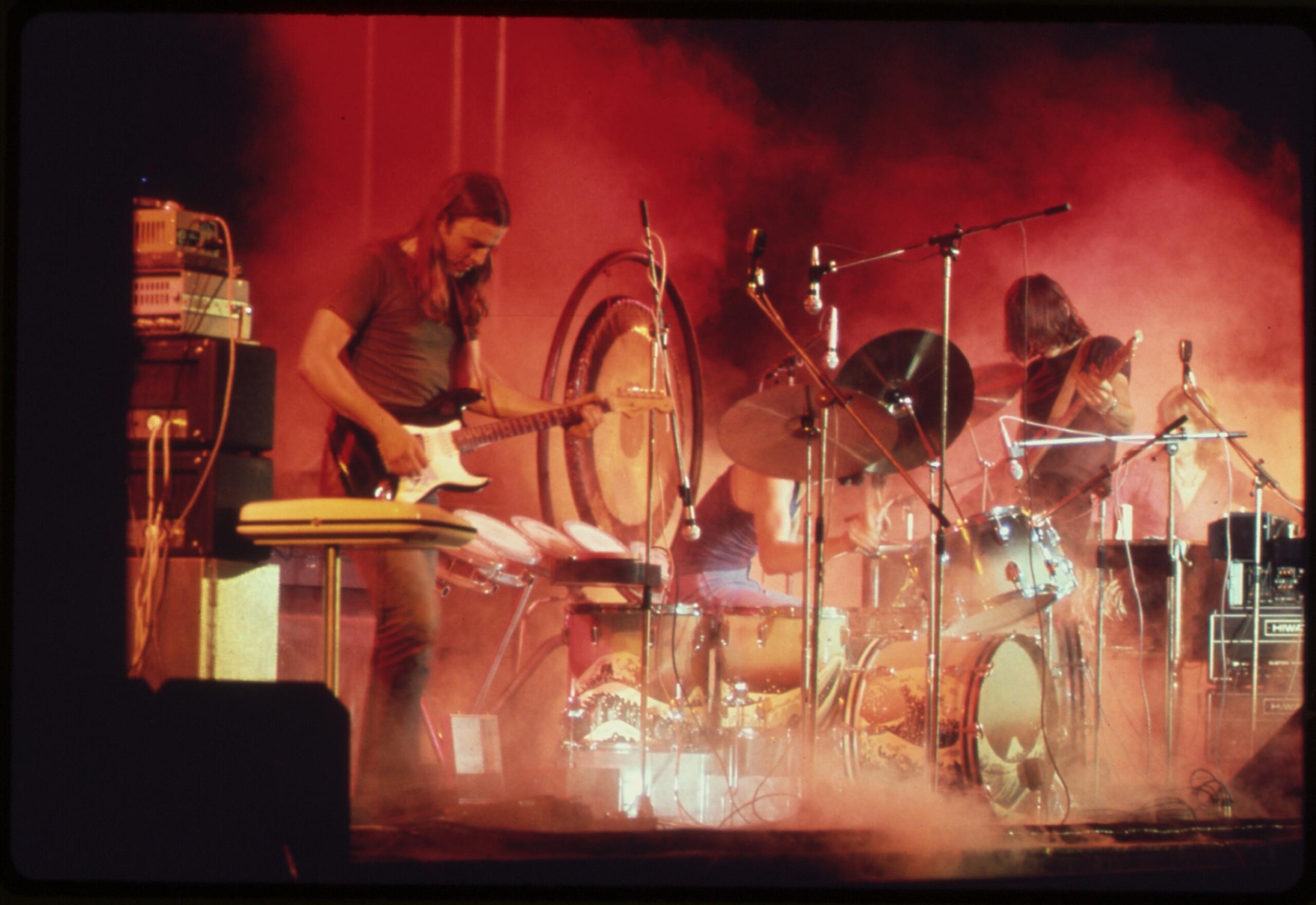 The band Pink Floyd on stage in 1974 with guitars and synthesizers
