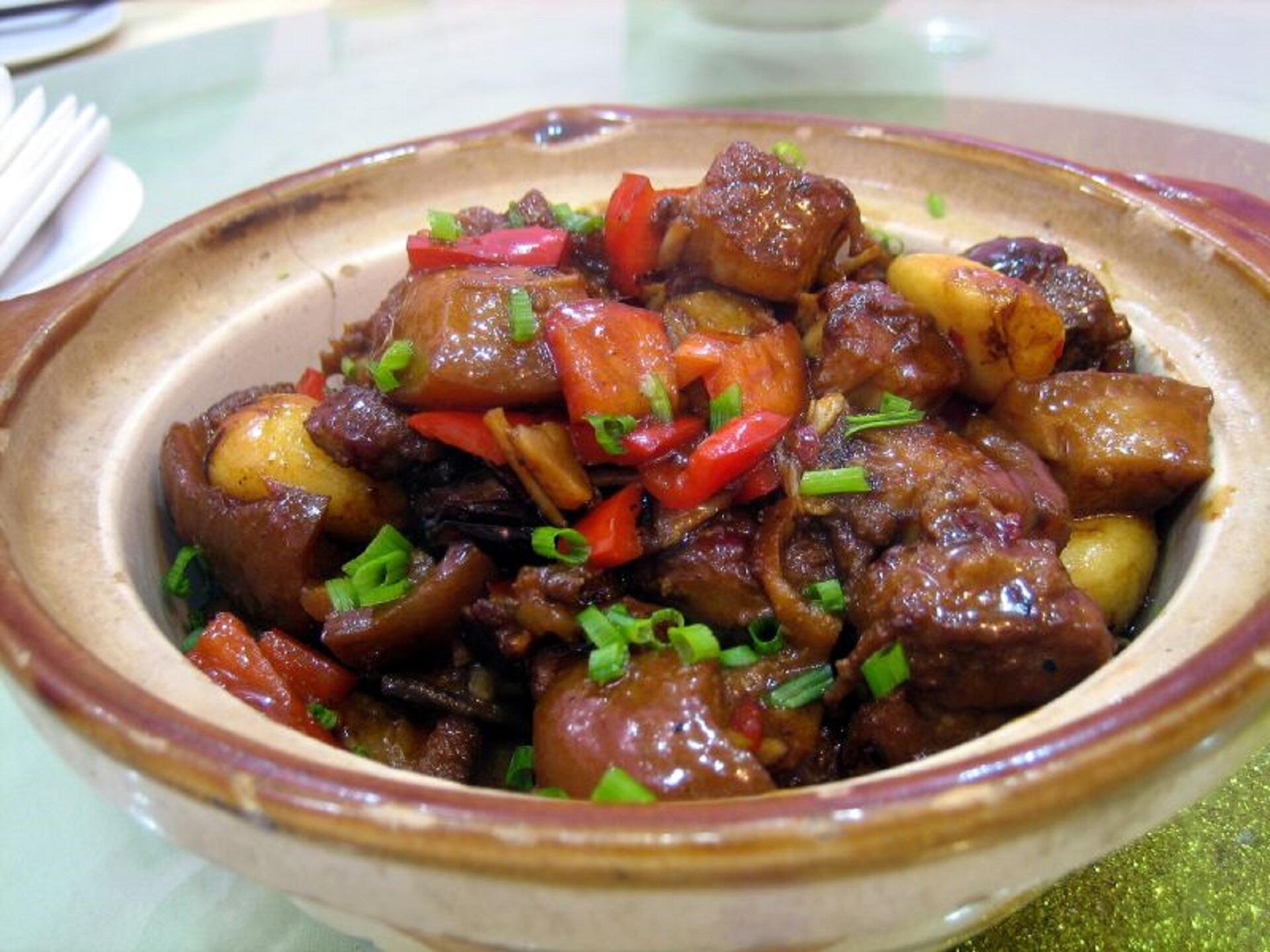 A dish full of cooked meat and vegetable.
