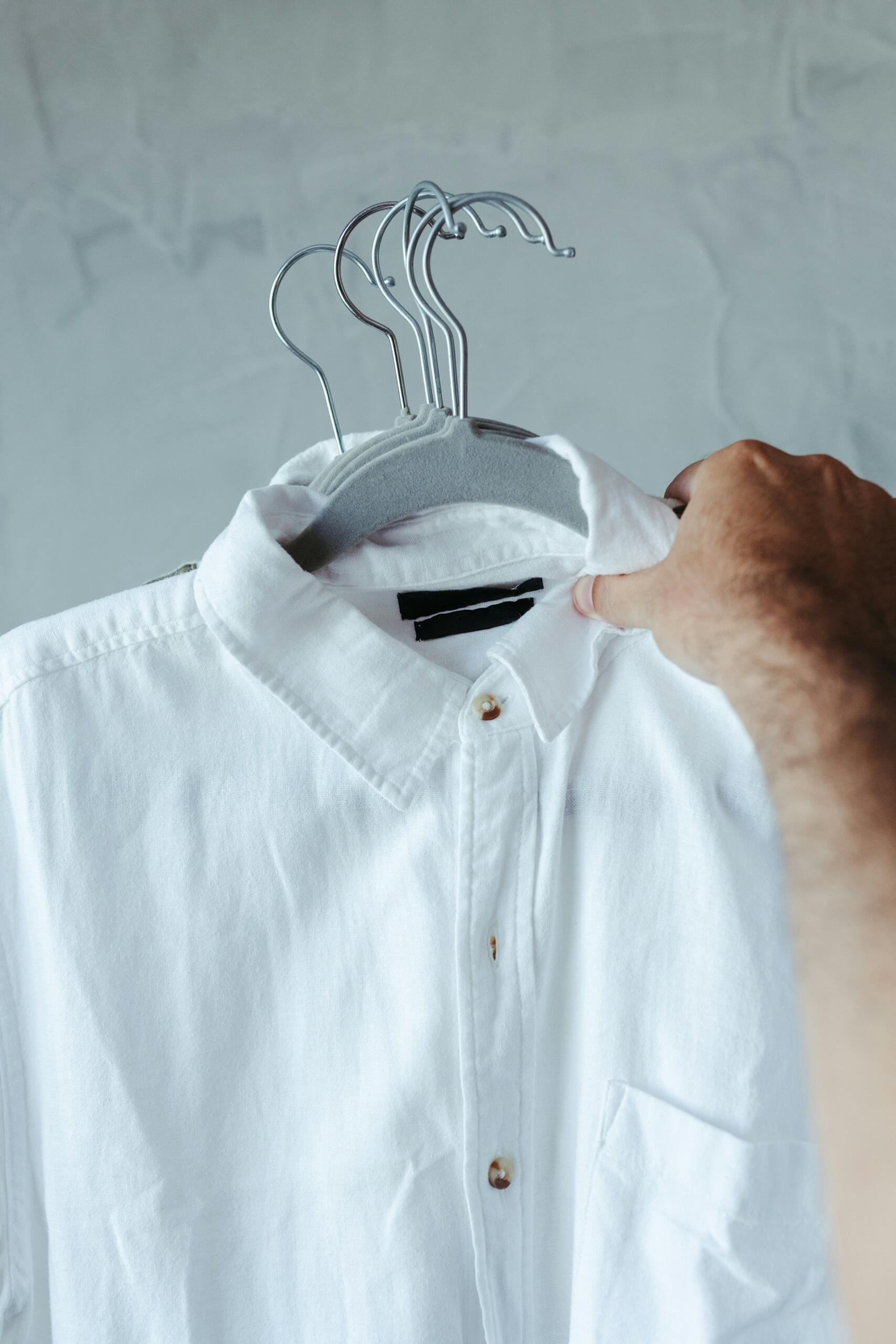 A white shirt on a hanger.