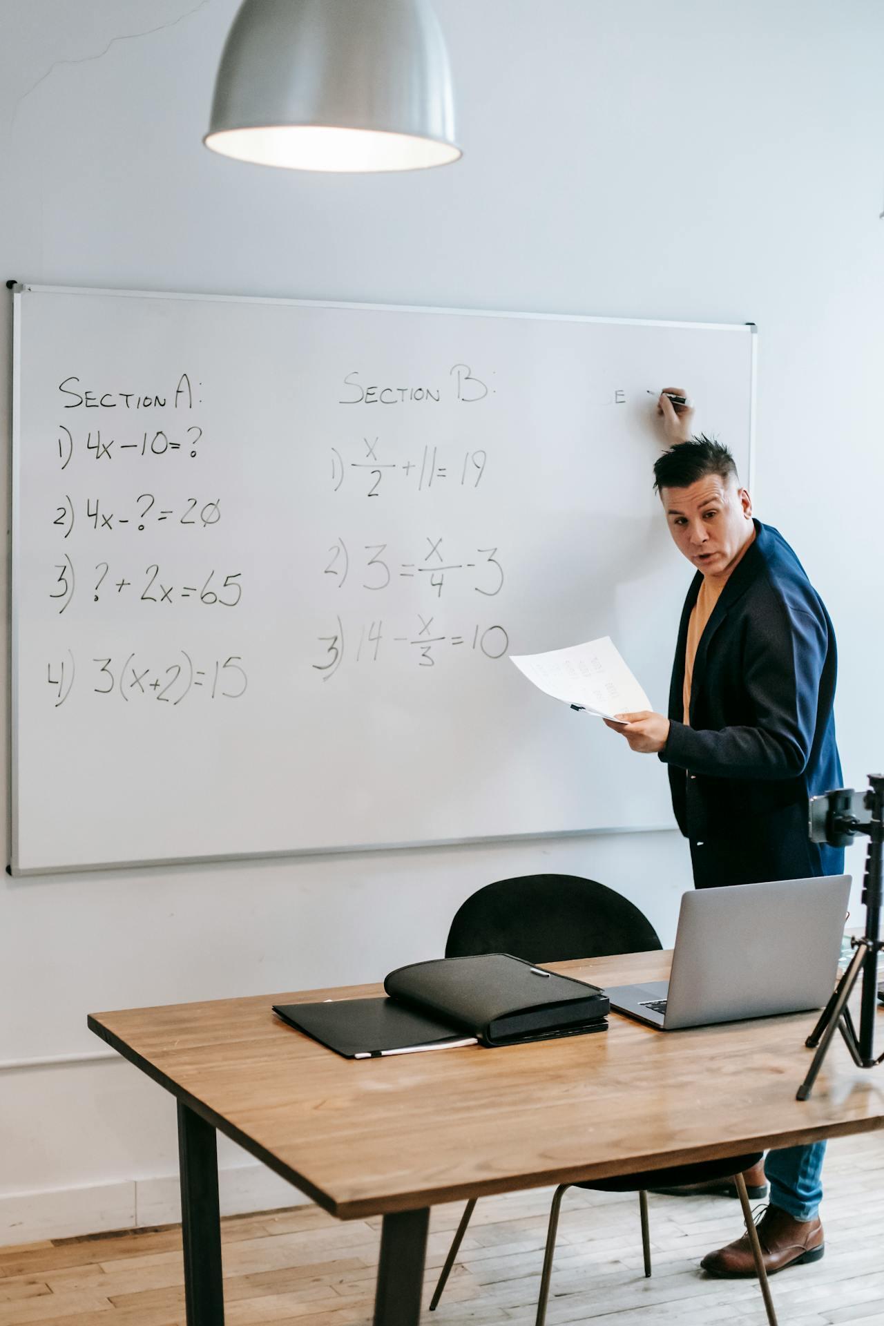a male tutor discussing math questions while being recorded.