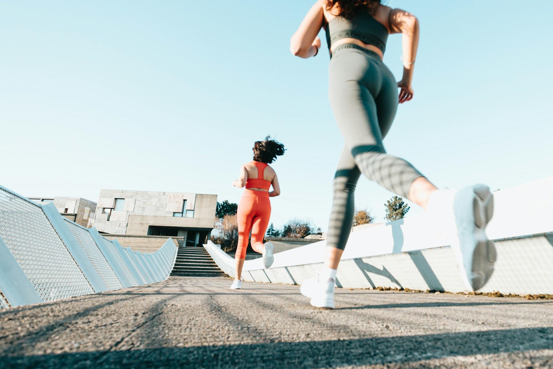Woman running on an outdoor running track