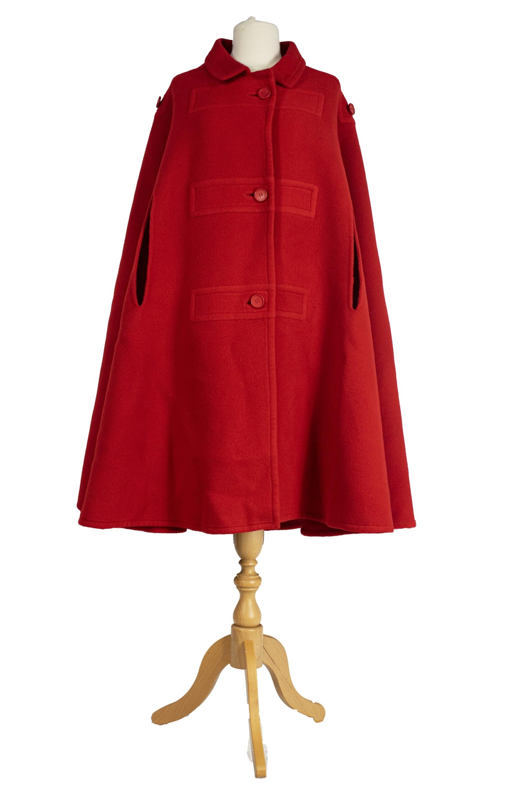 A red cape on a dressmaker's dummy.