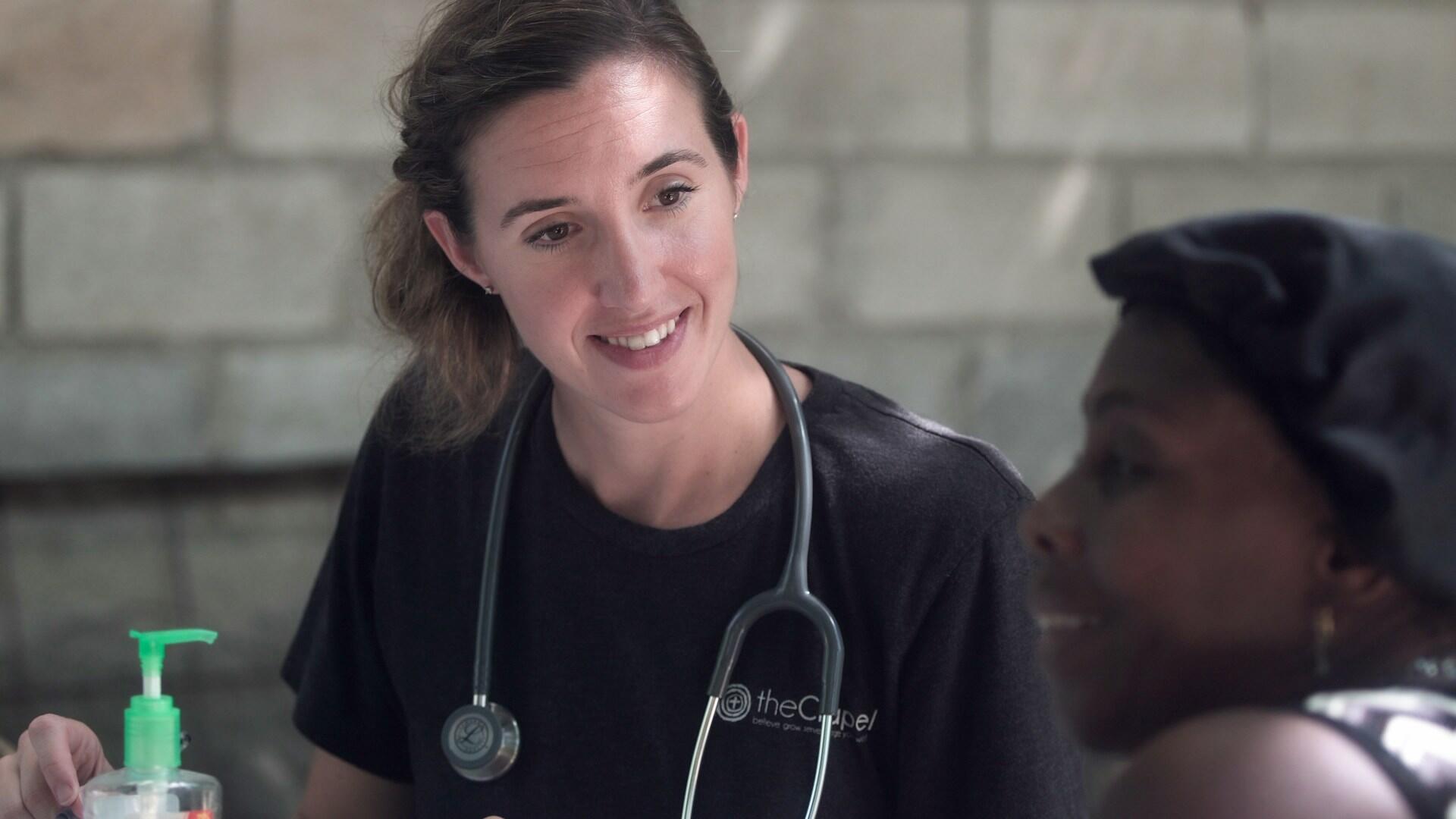 female nurse listening to a patient
