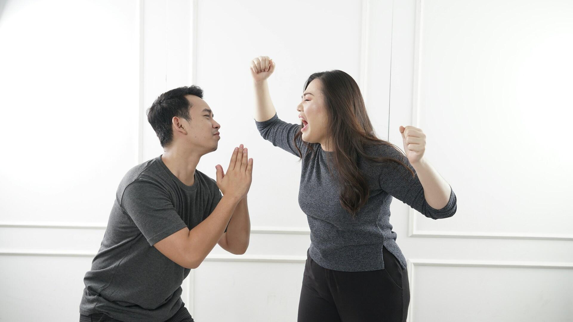 A man and woman arguing.