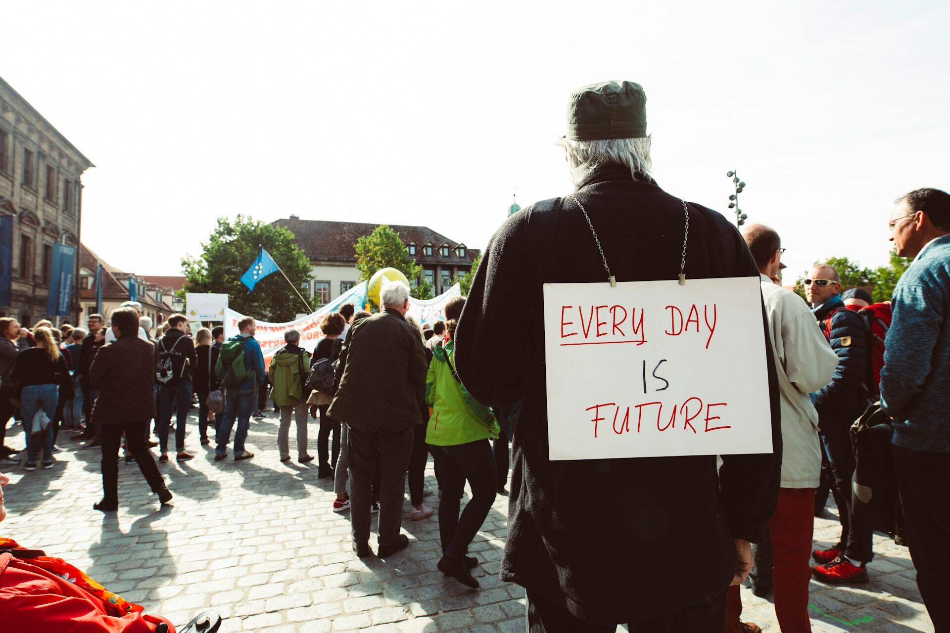 People in the street with signs.