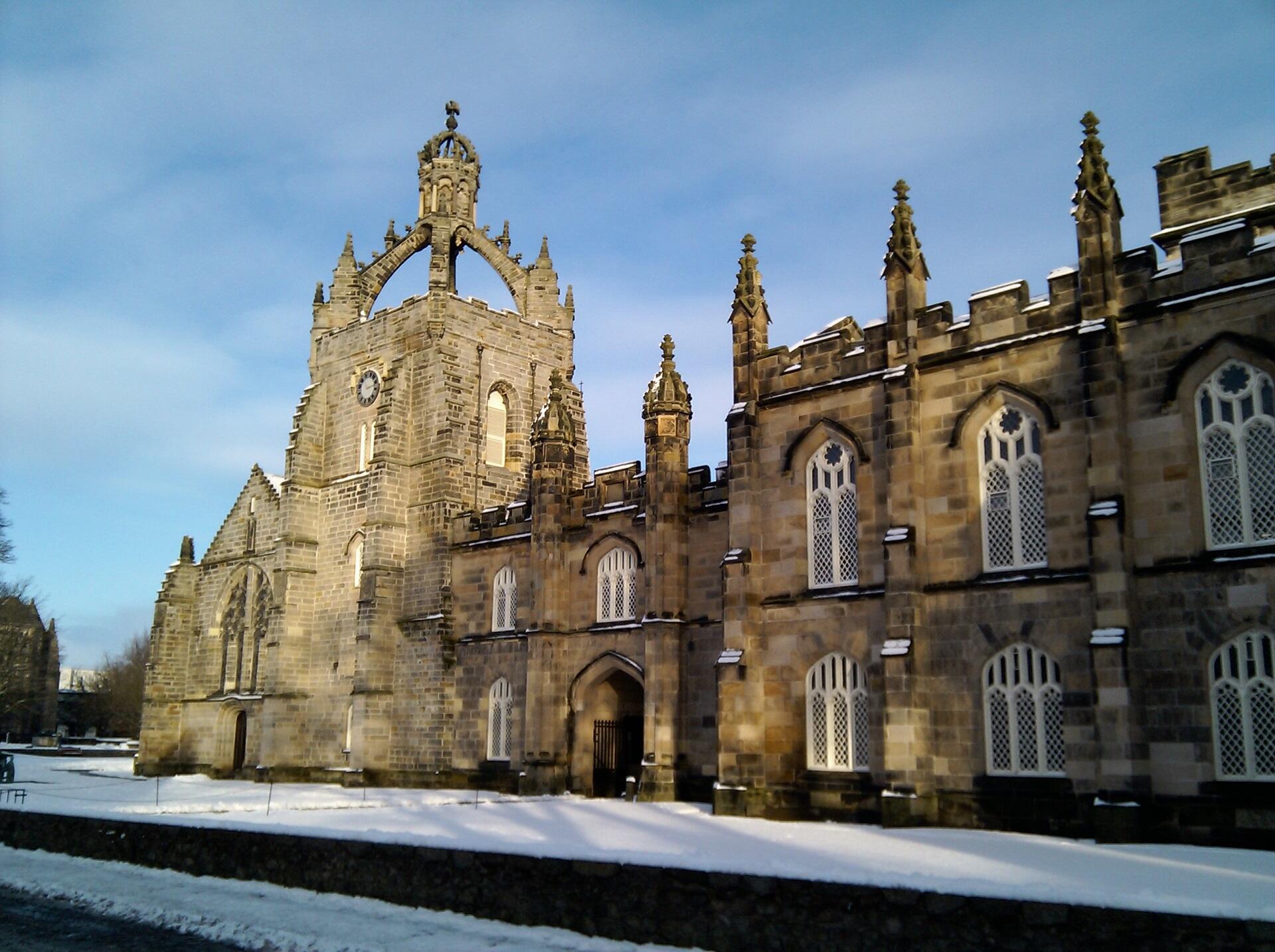 A large stone building on a sunny day,