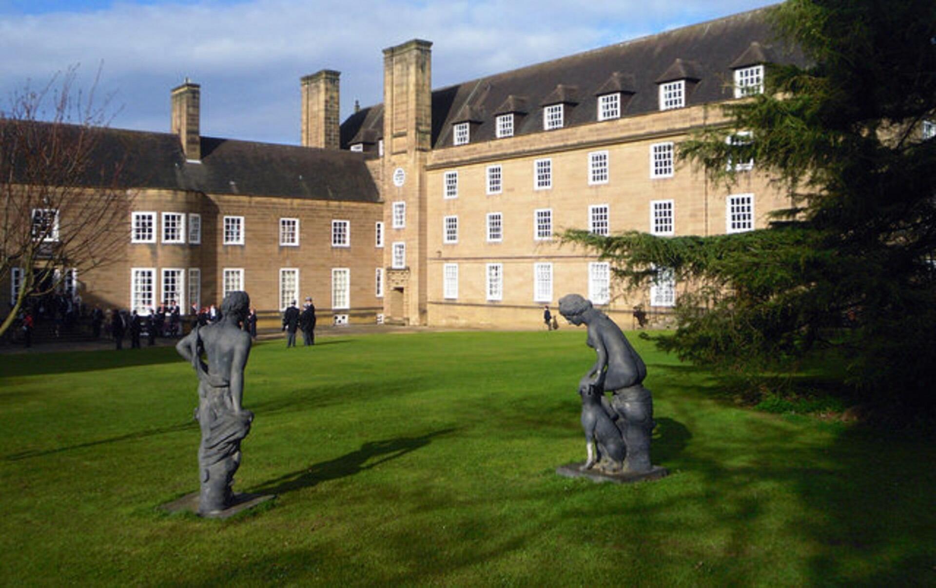 Statues on a lawn on a sunny day.