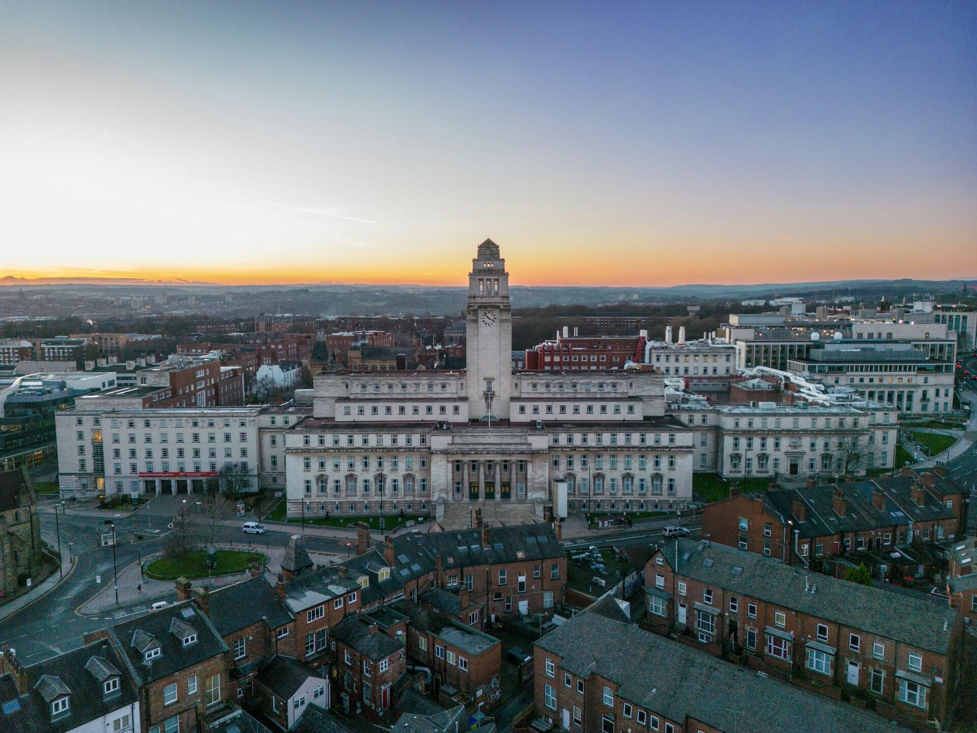 A large white building at sunset. 