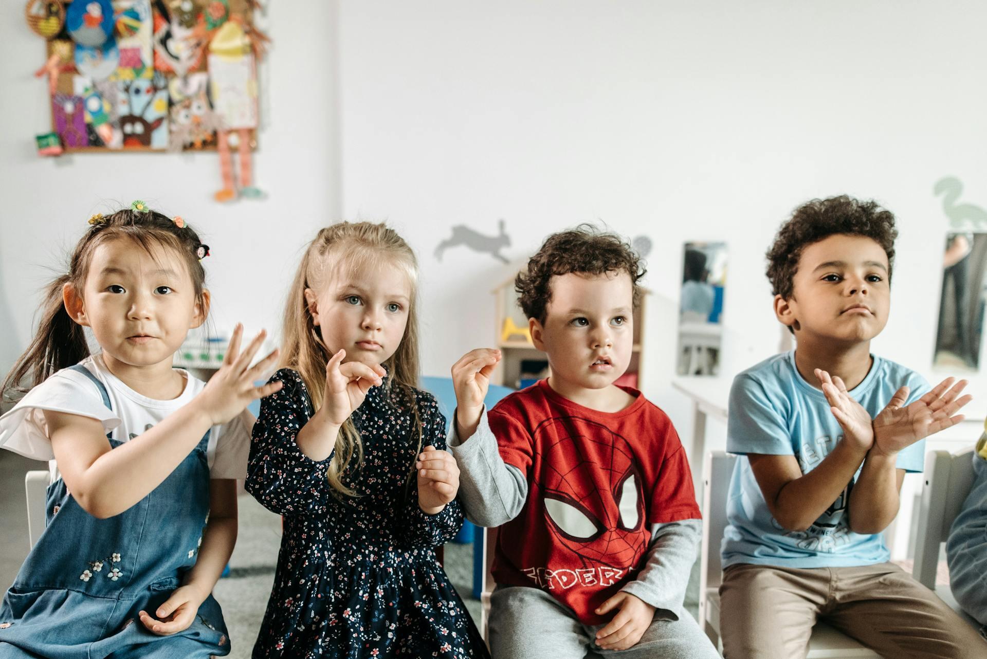 Four children signing.