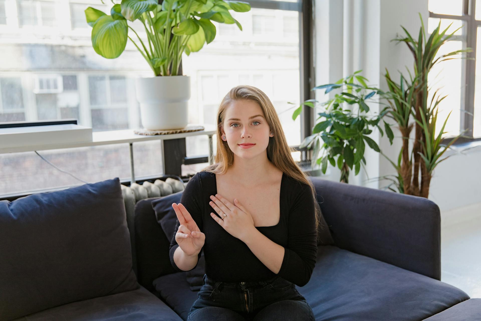 Woman signing ASL.