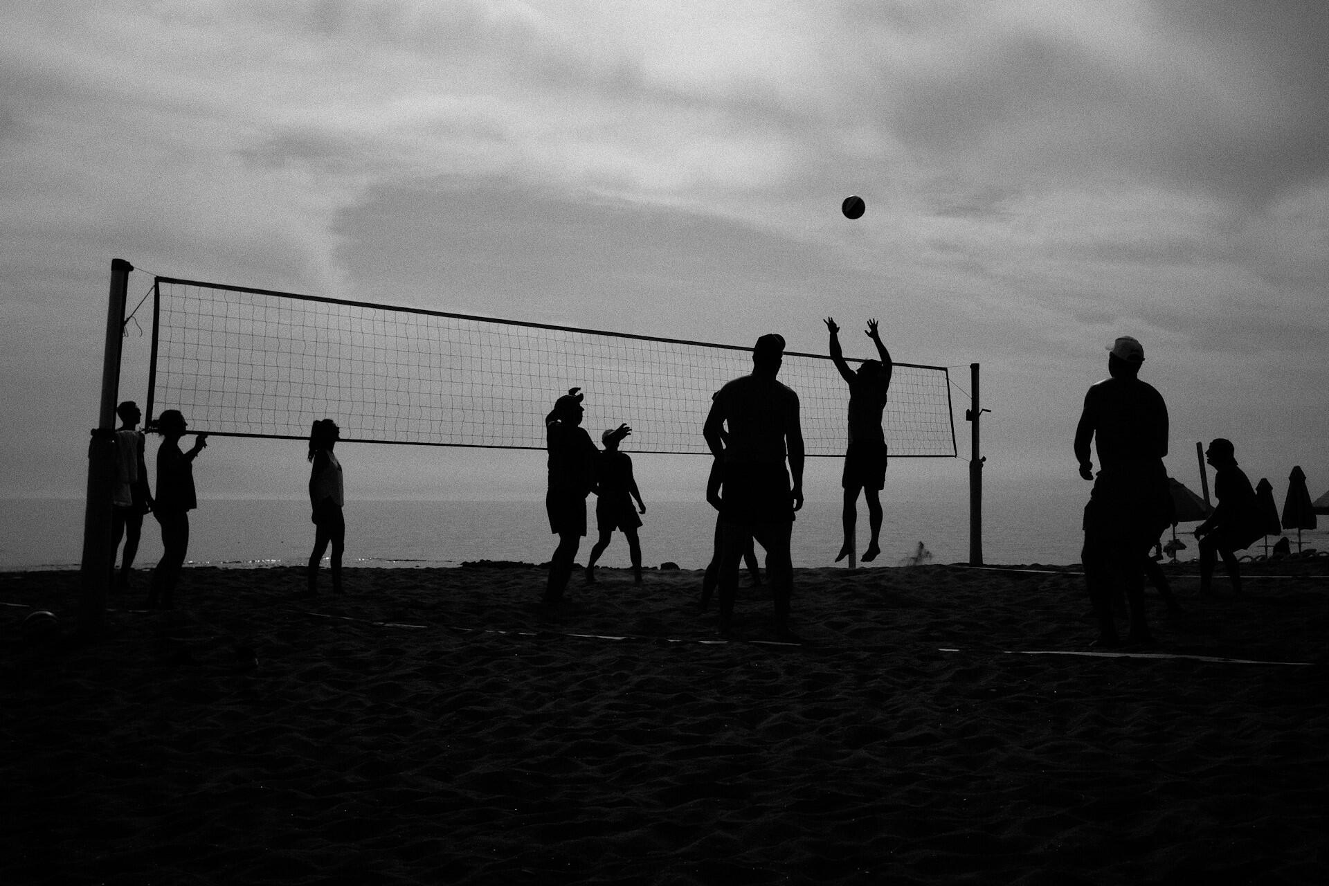 People playing beach volleyball.