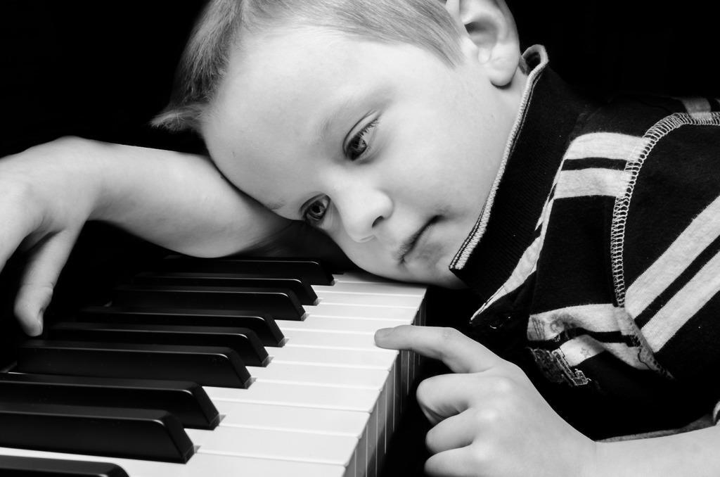 young boy playing the piano