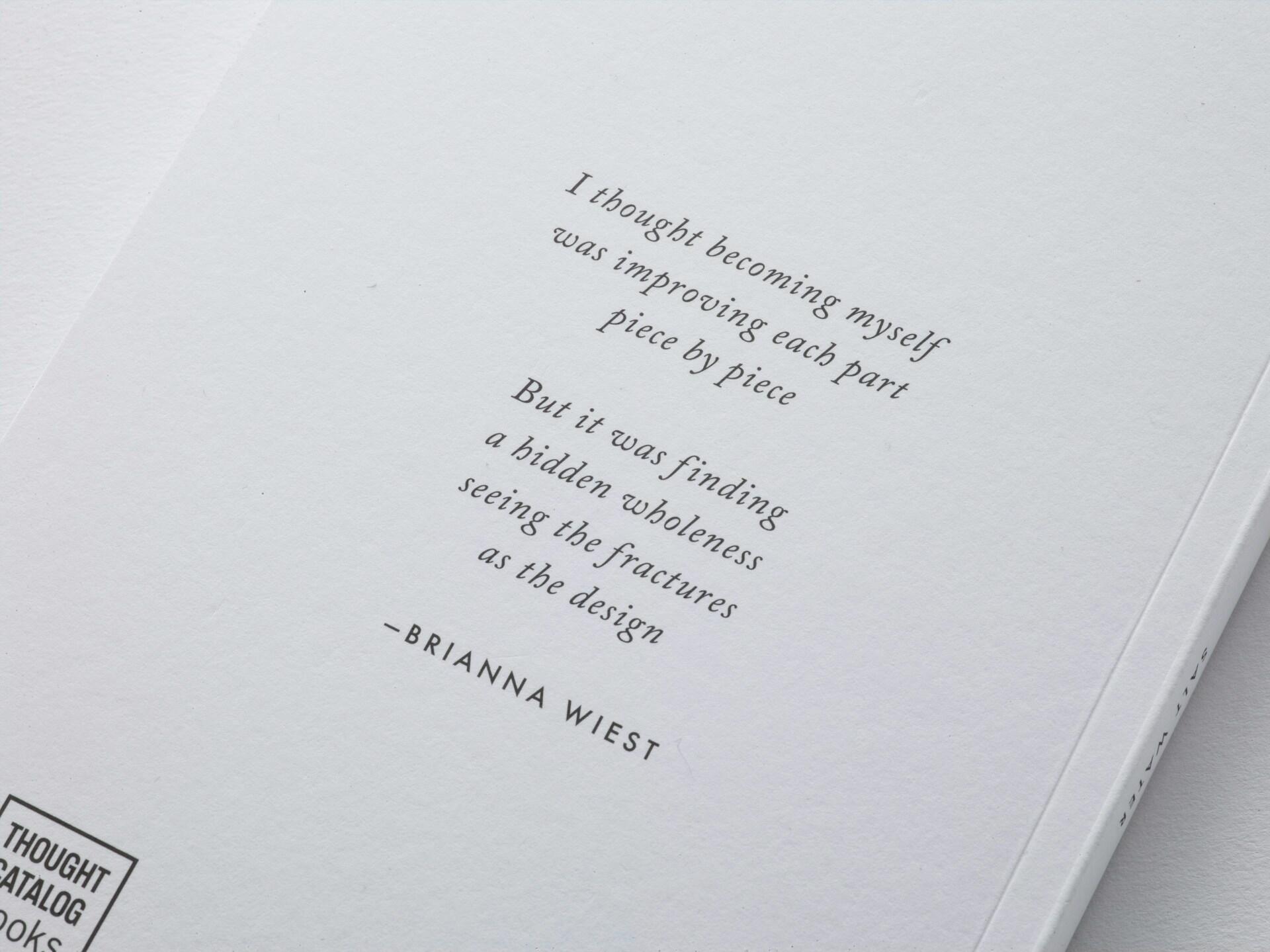 A poem printed in cursive script on a white paper.