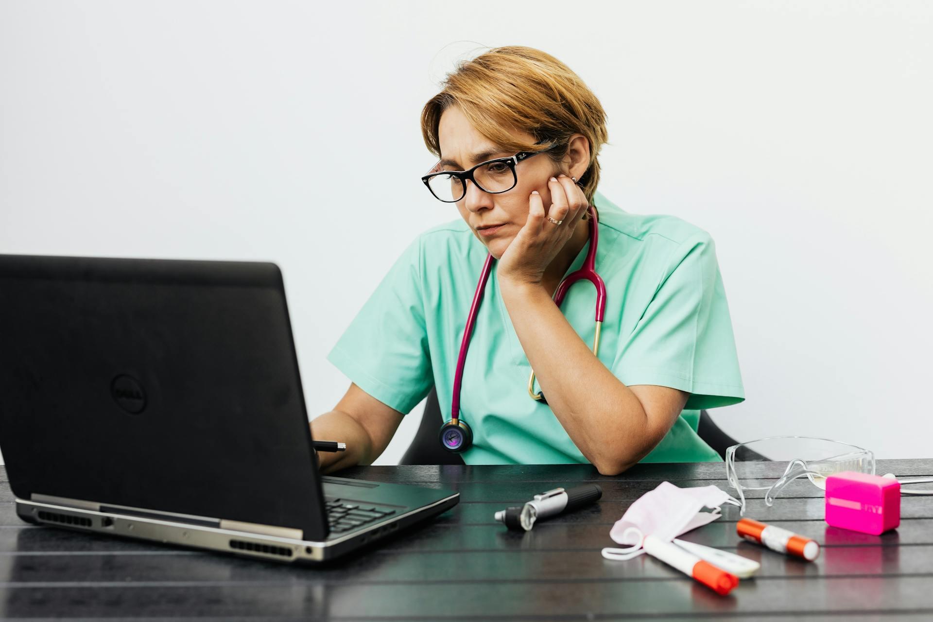 nurse looking at computer