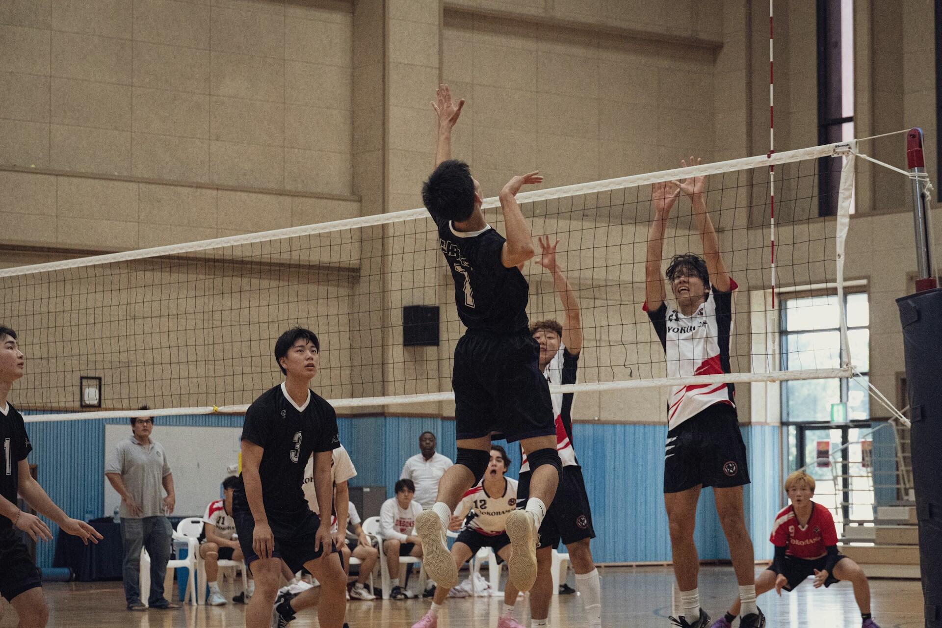 An opposite hitter prepares to hit the ball.