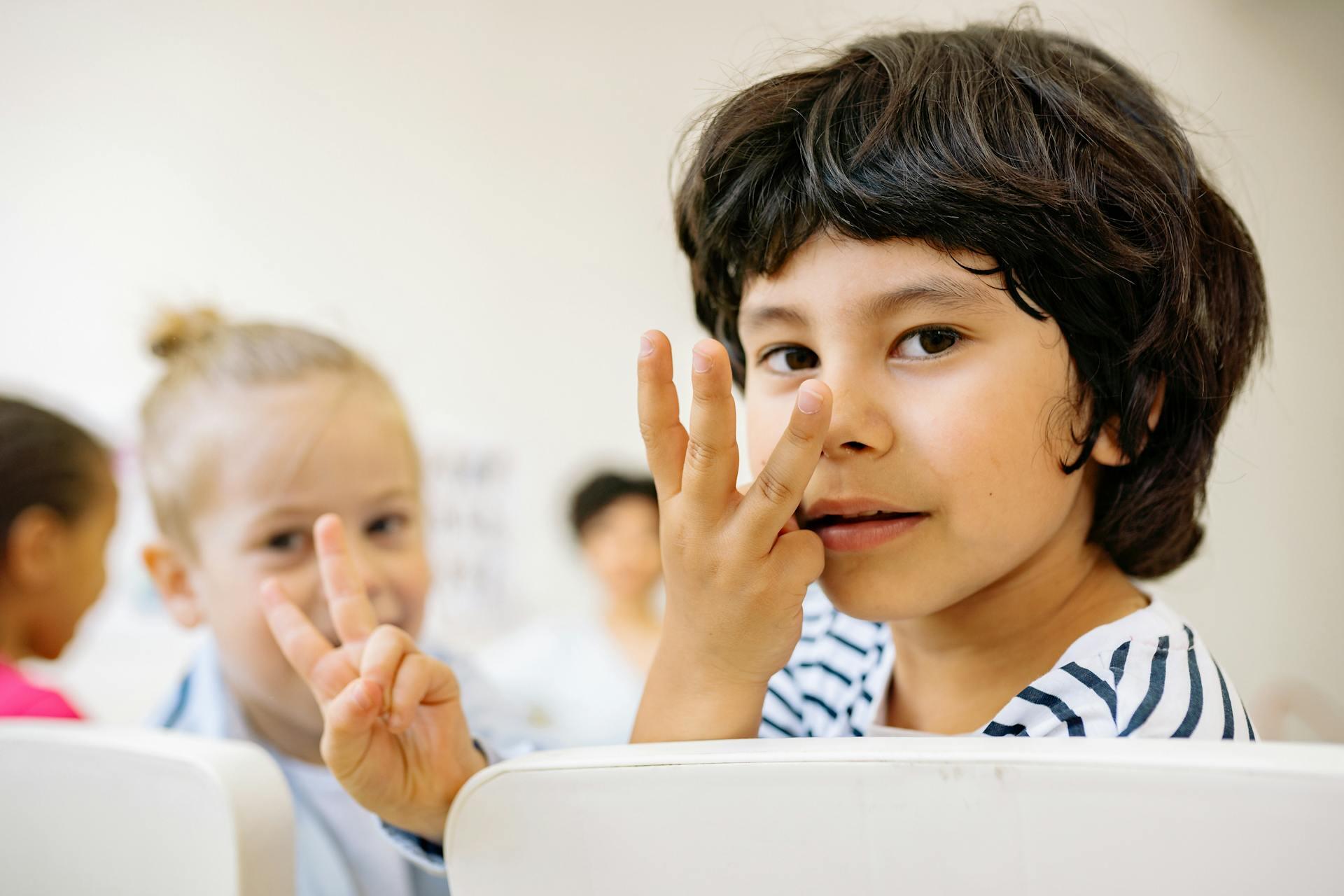 Kids practicing ASL