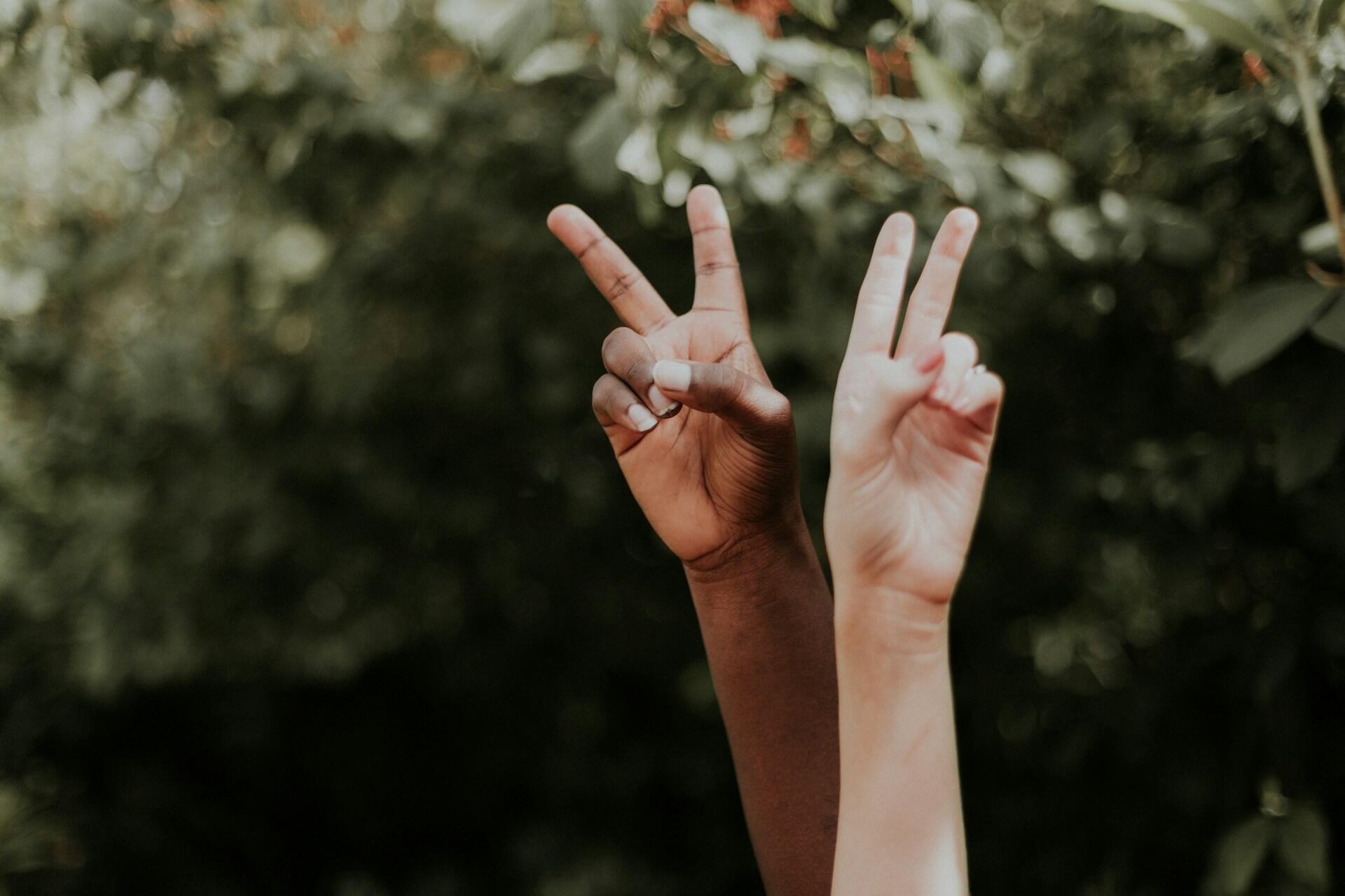 Two peace and love signs.