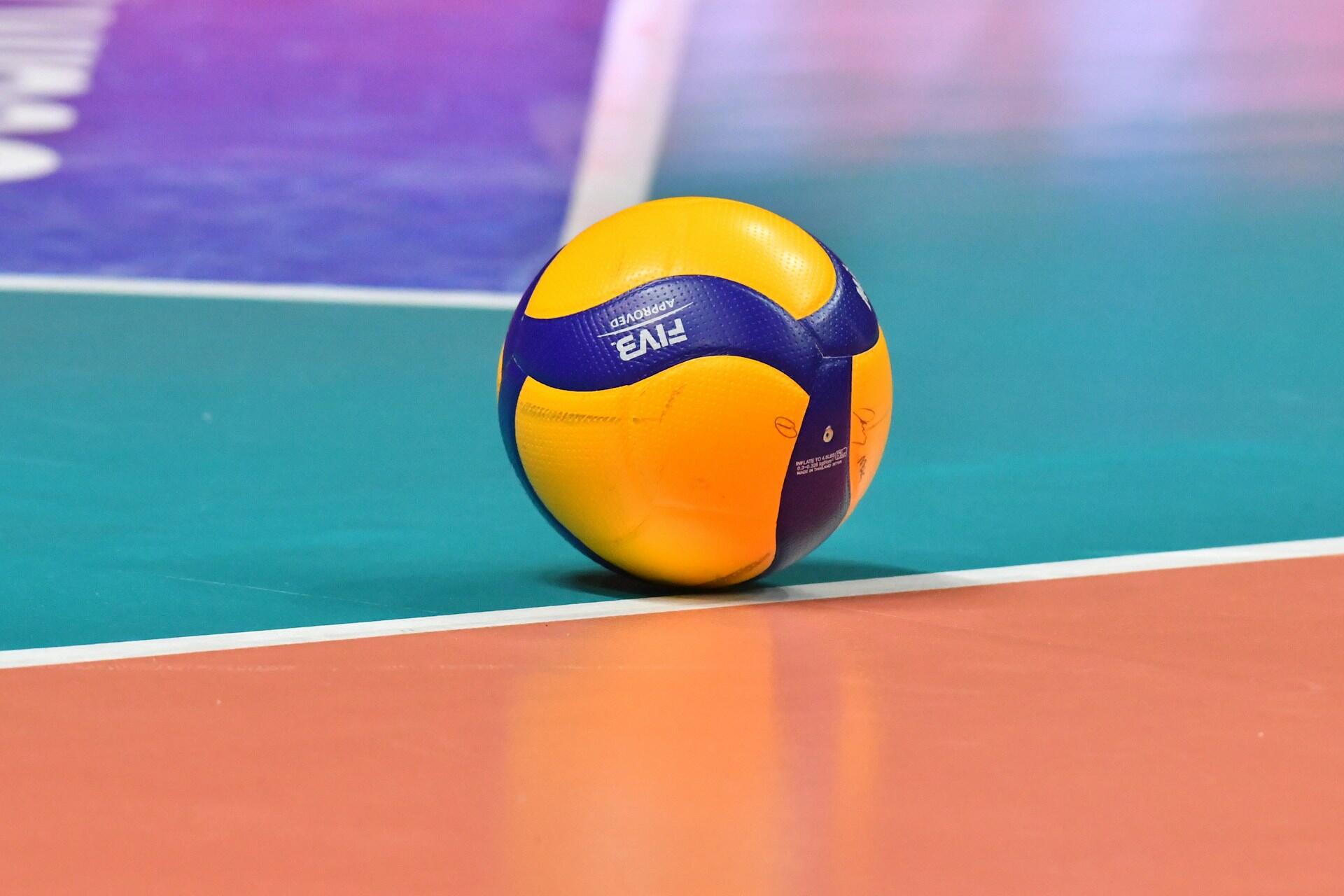 A volleyball on a court.
