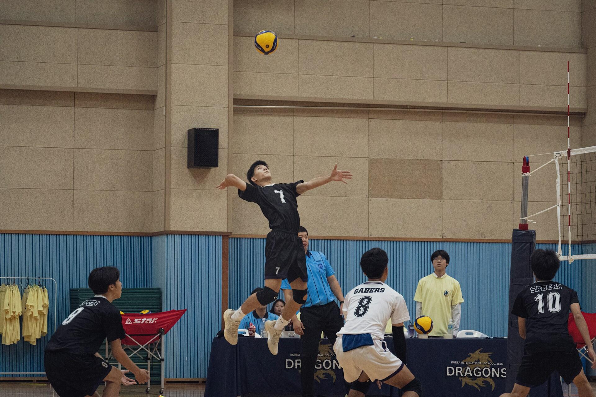 A volleyball player preparing for a hit.