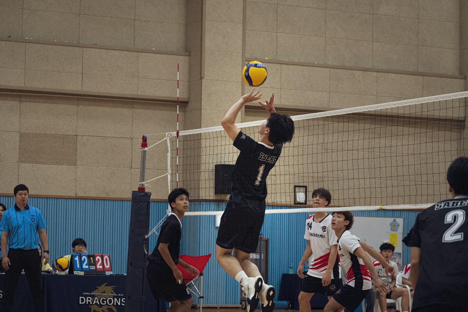 A volleyball setter preparing a set.