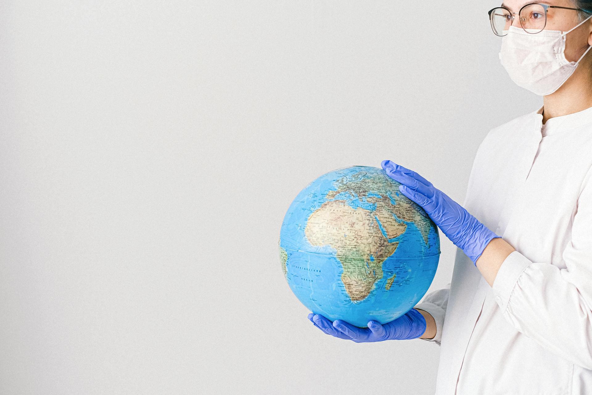 nurse holding a globe