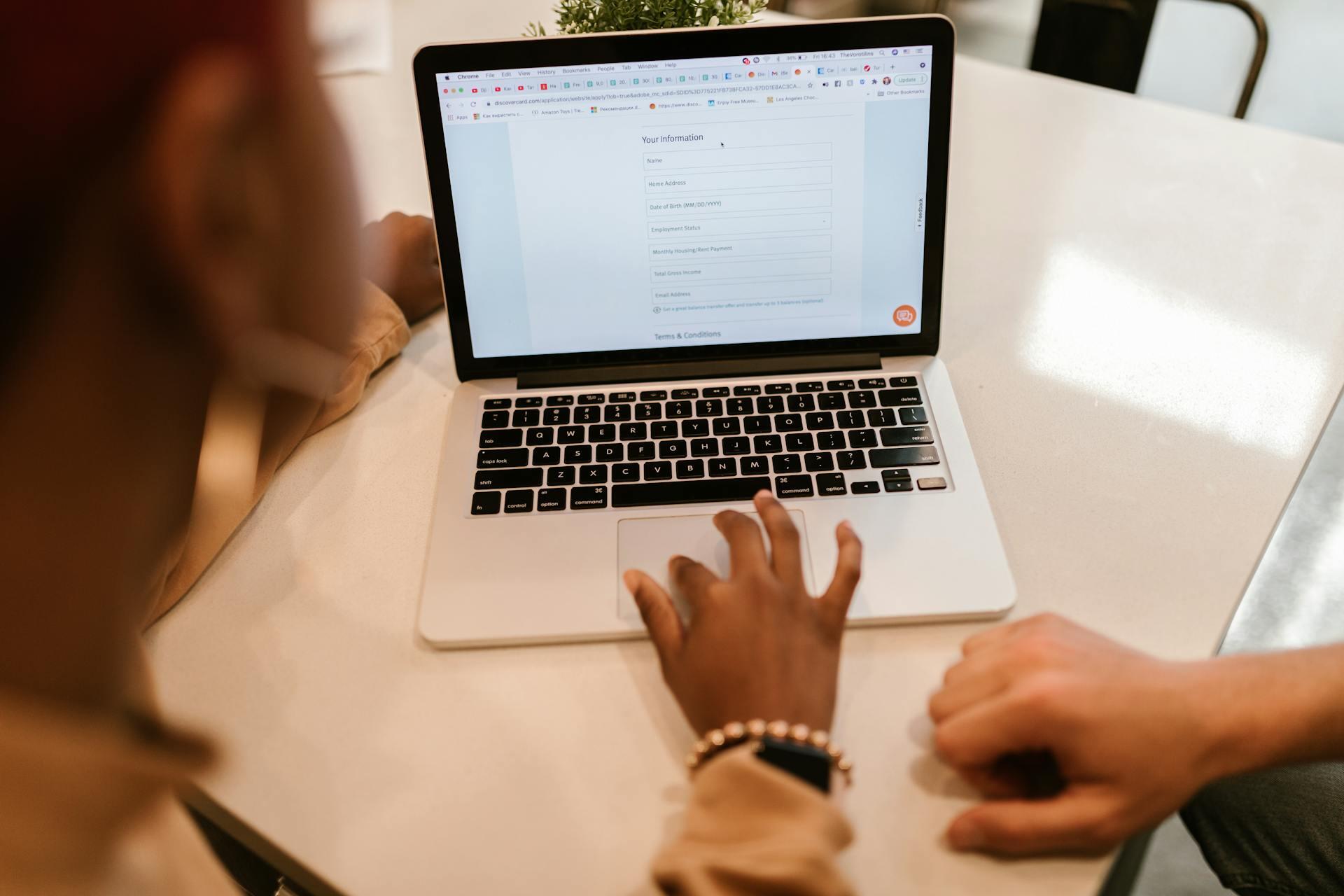 lady filling out a form on laptop