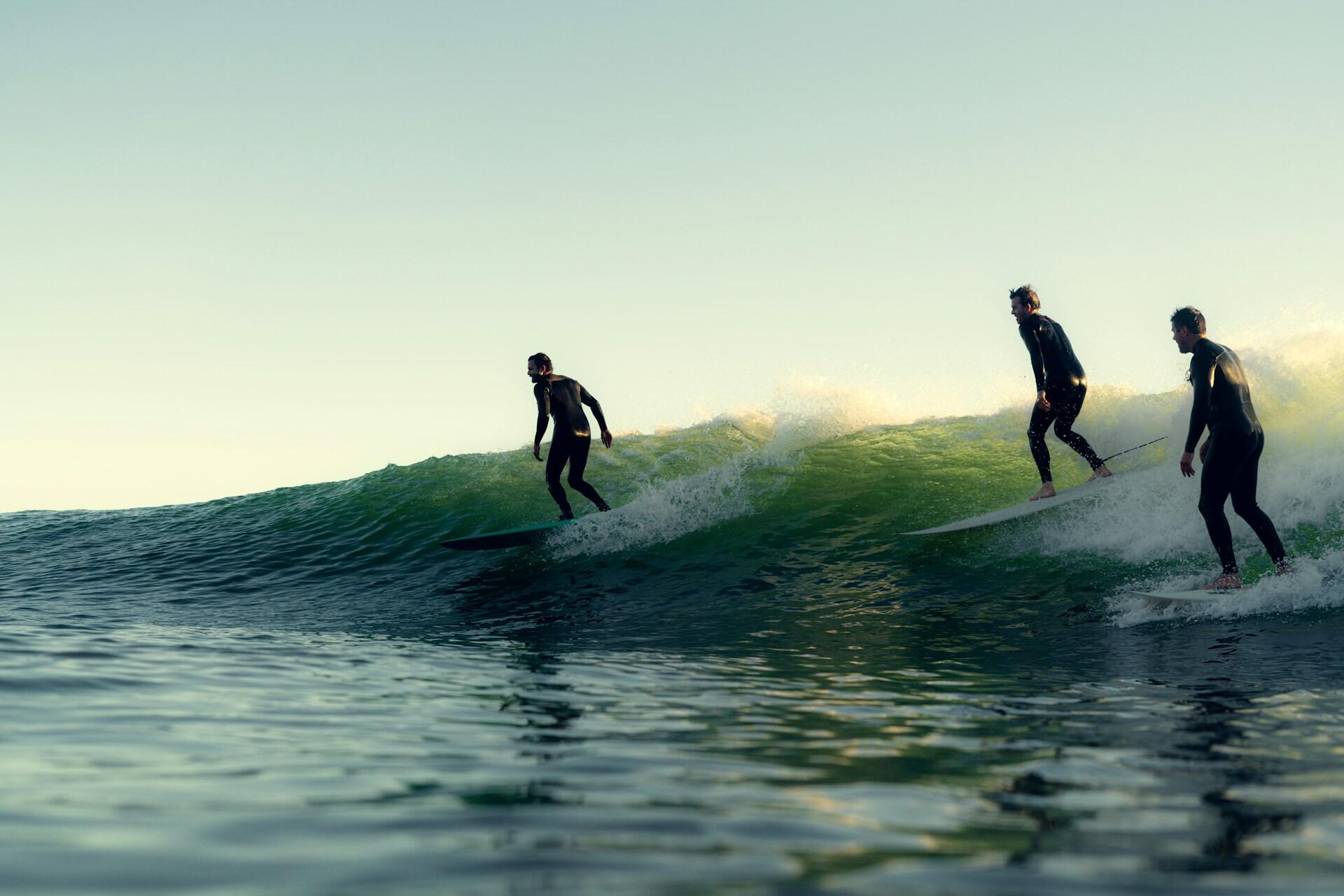 People surfing on shortboards.
