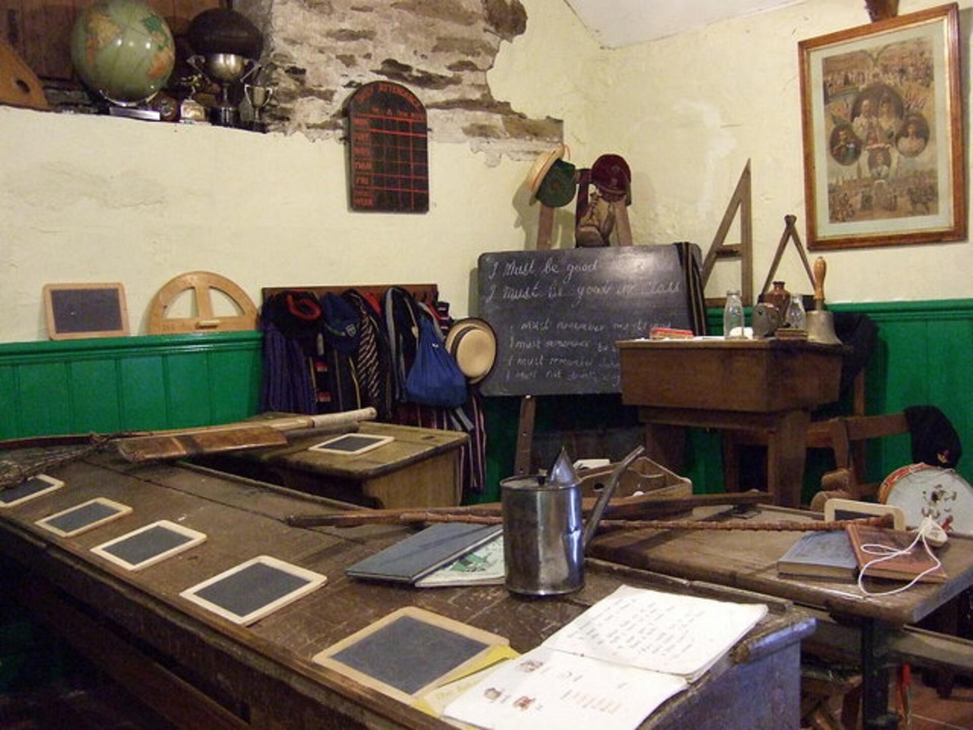 An old-time classroom with slates where pupils sat.