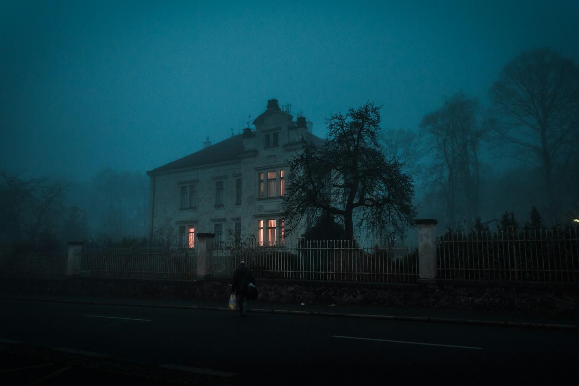 A large, isolated house on a murky evening.