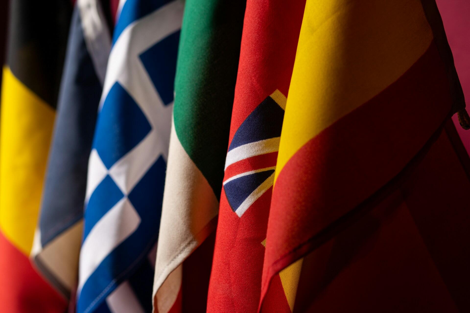 A collection of various coloured flags from different countries.