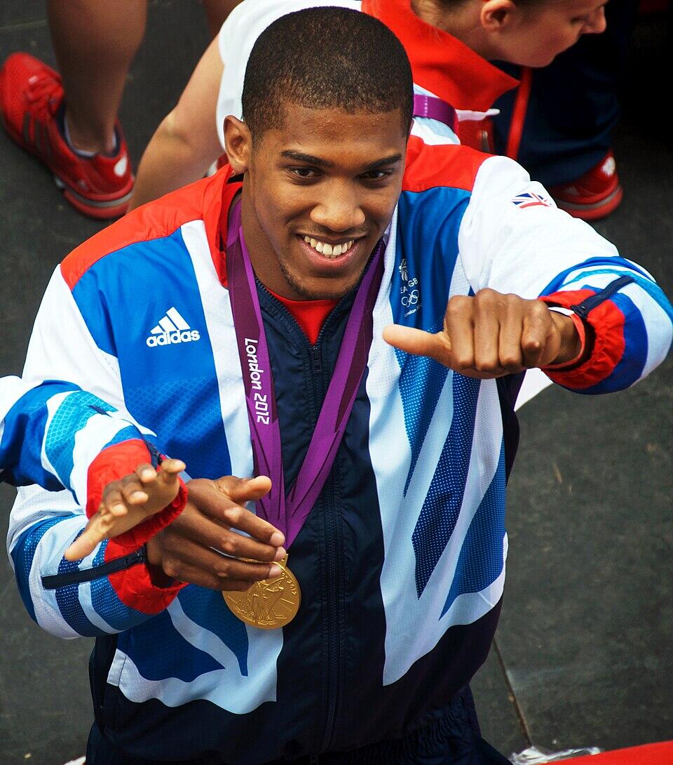 Photo of Anthony Joshua holding a thumb up to camera at olympics