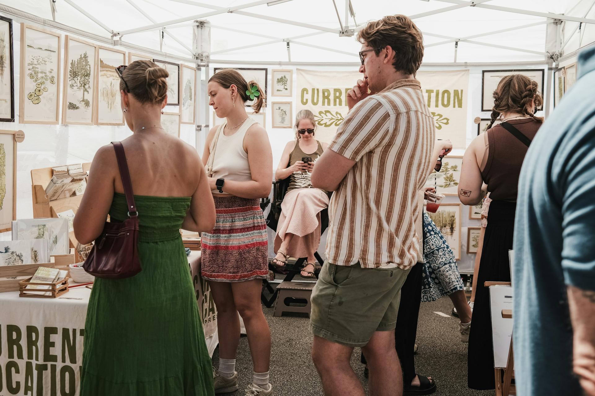 people buying art an an art fair