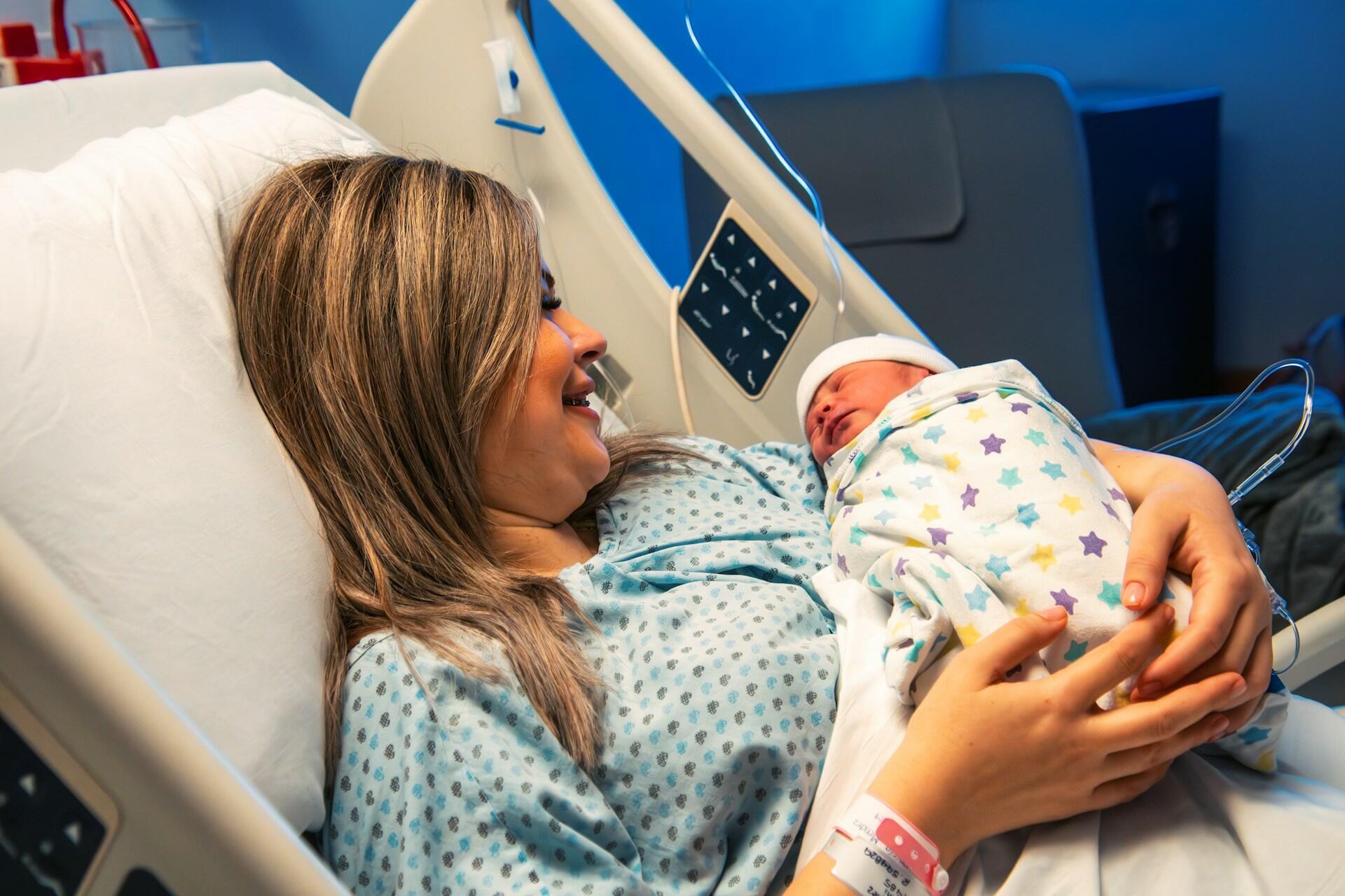 A mother with a newborn baby.