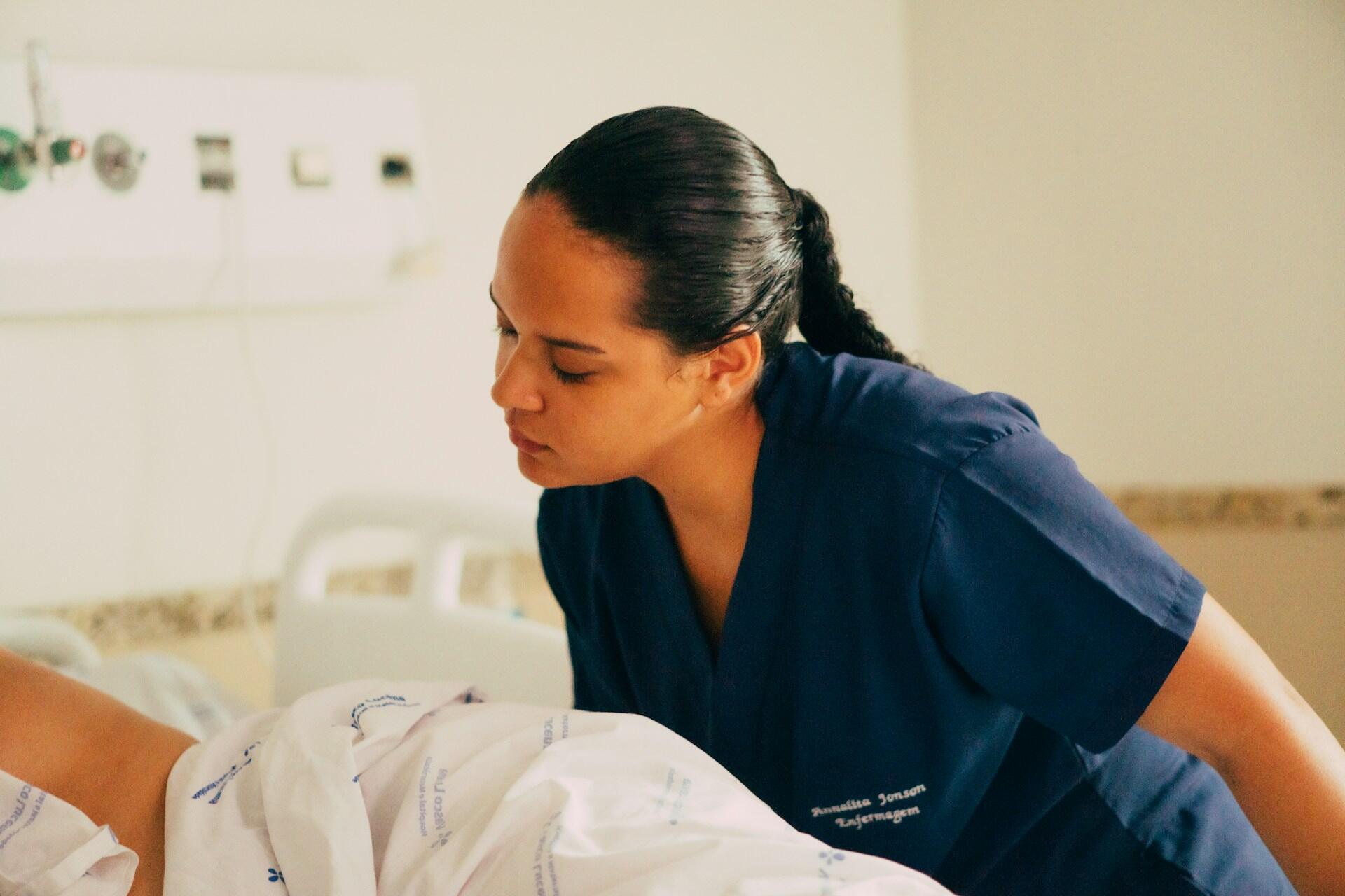A nurse monitoring a patient.