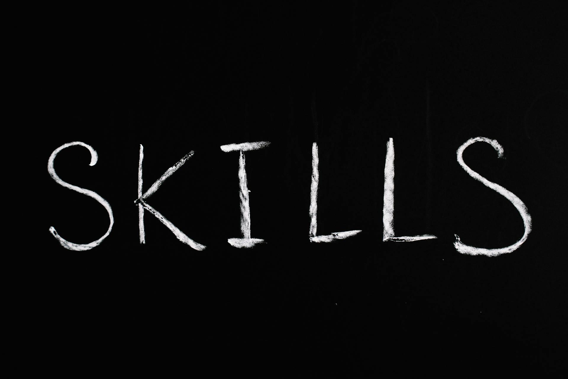 black and white image of chalkboard text saying skills