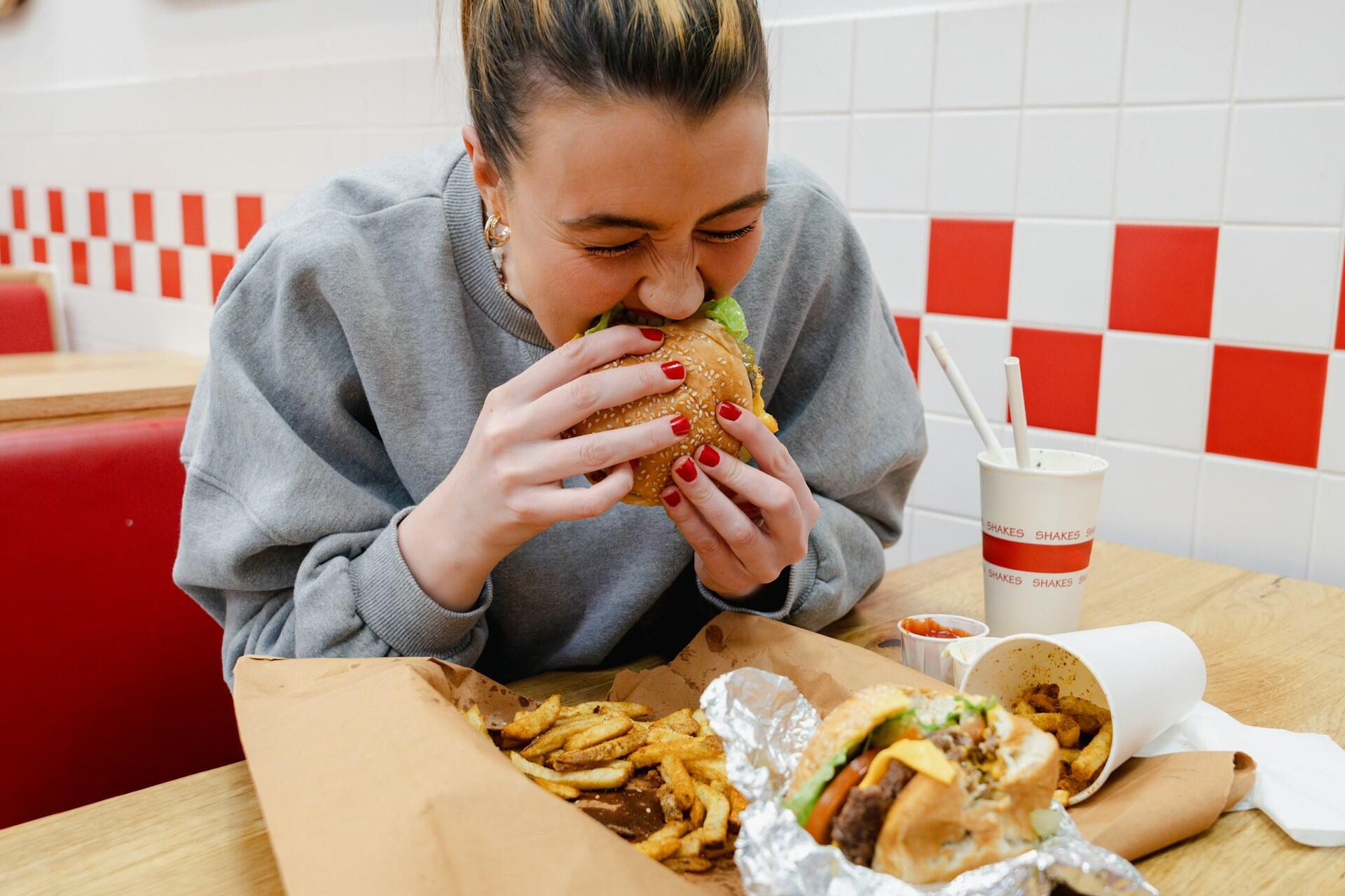 A person eating a lot of food.