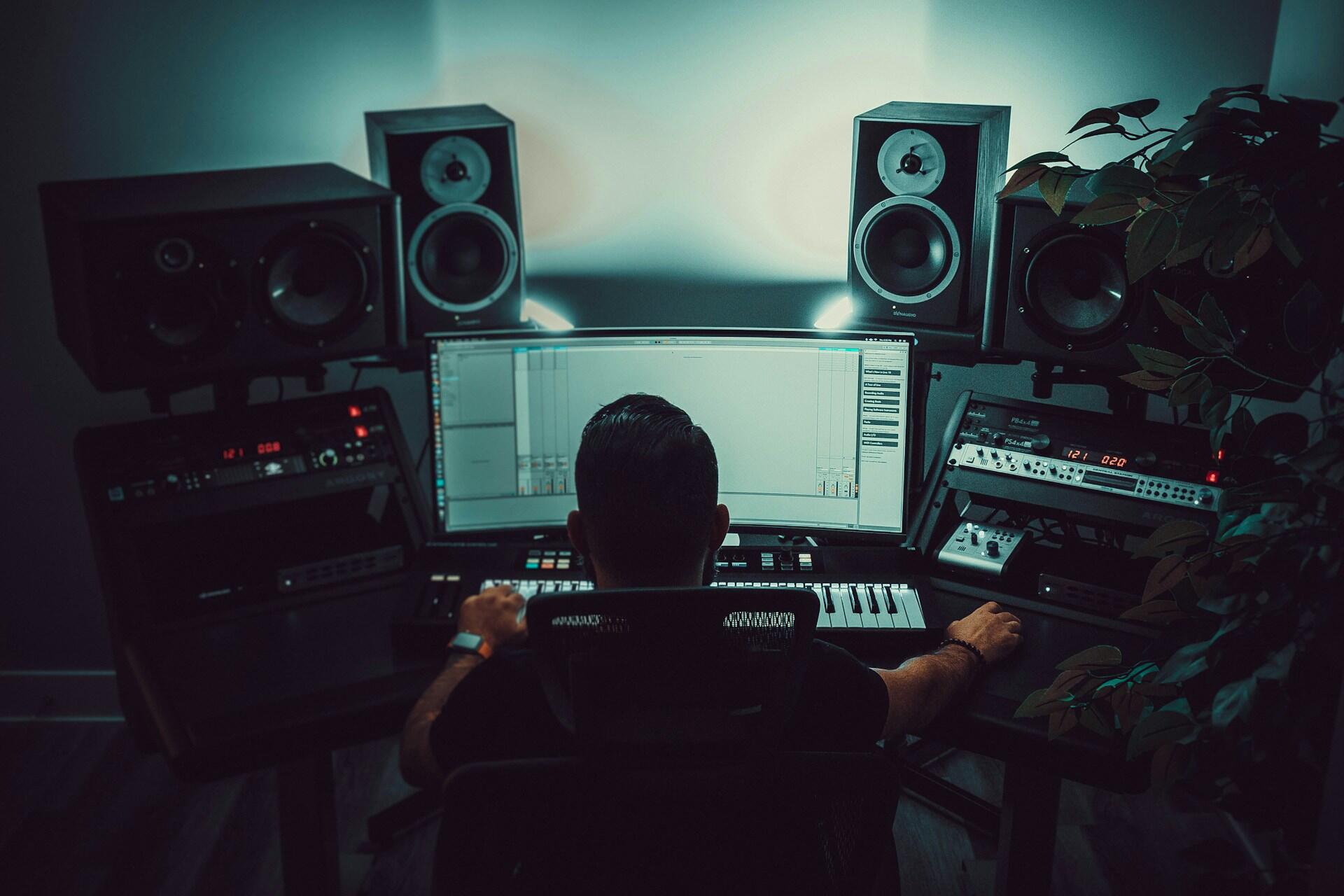 A music producer working at a computer.
