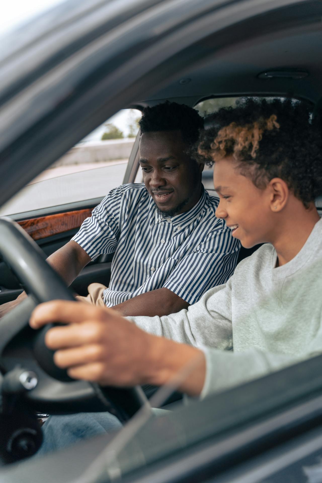 young driver with experienced passenger teaching about driving