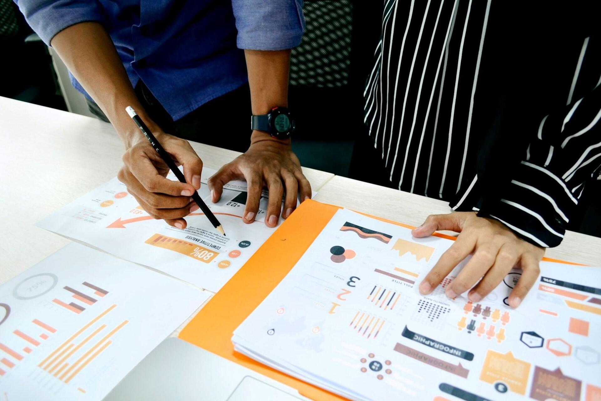 People looking at analytics during a meeting.