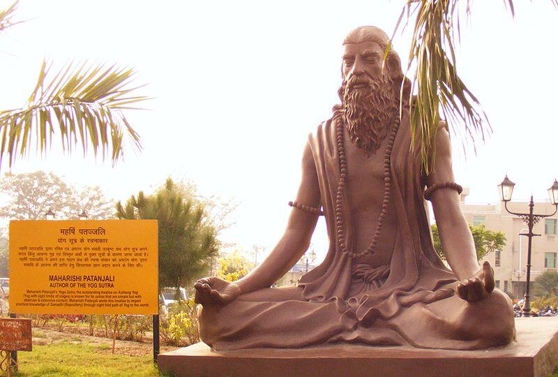 statue of patanjali in yoga posture