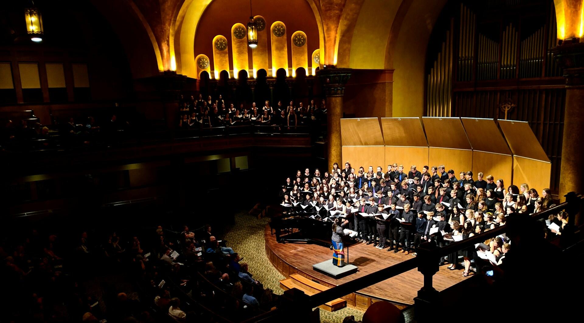 Choral group performing on stage
