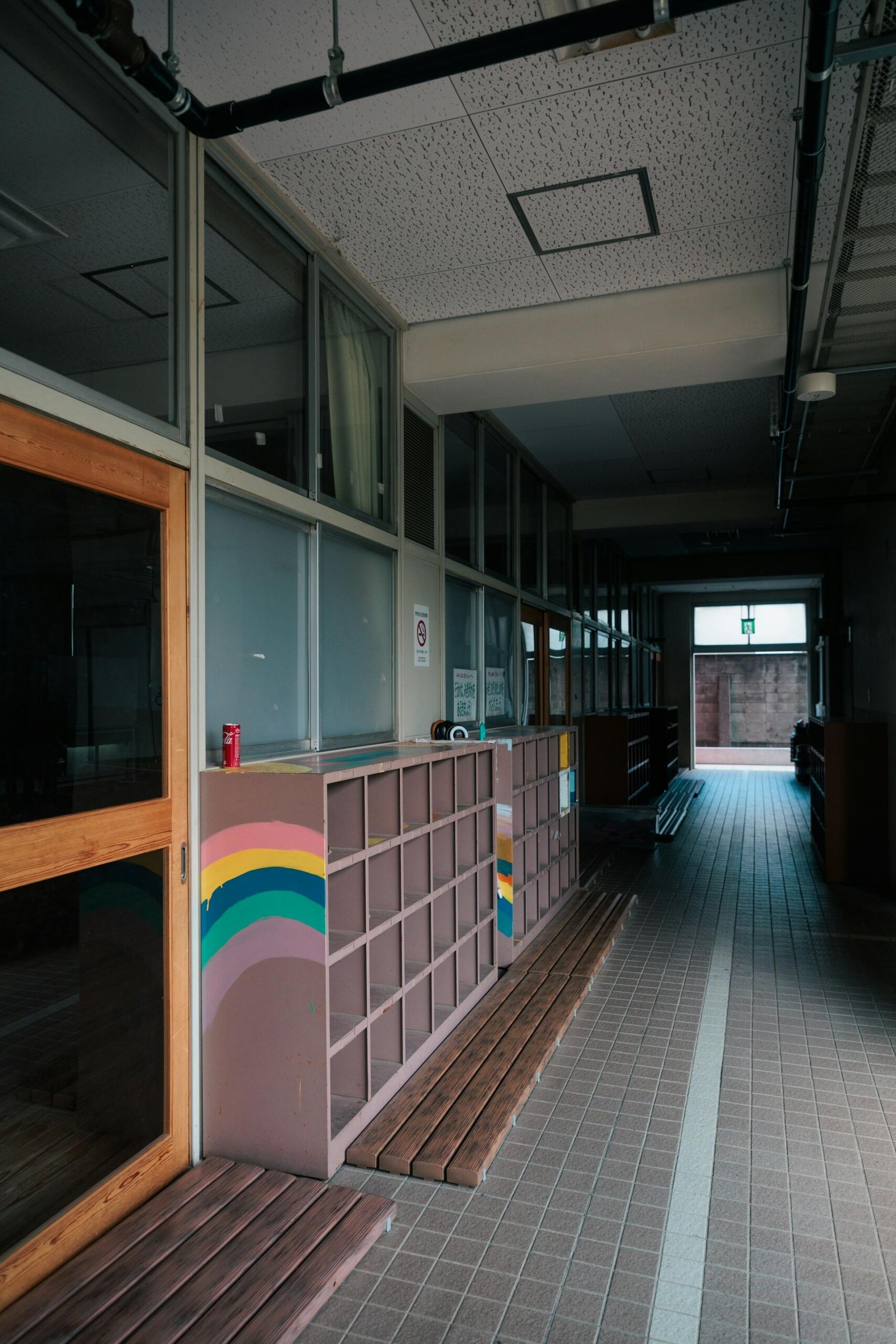An older school hallways with narrow doors and halls. 