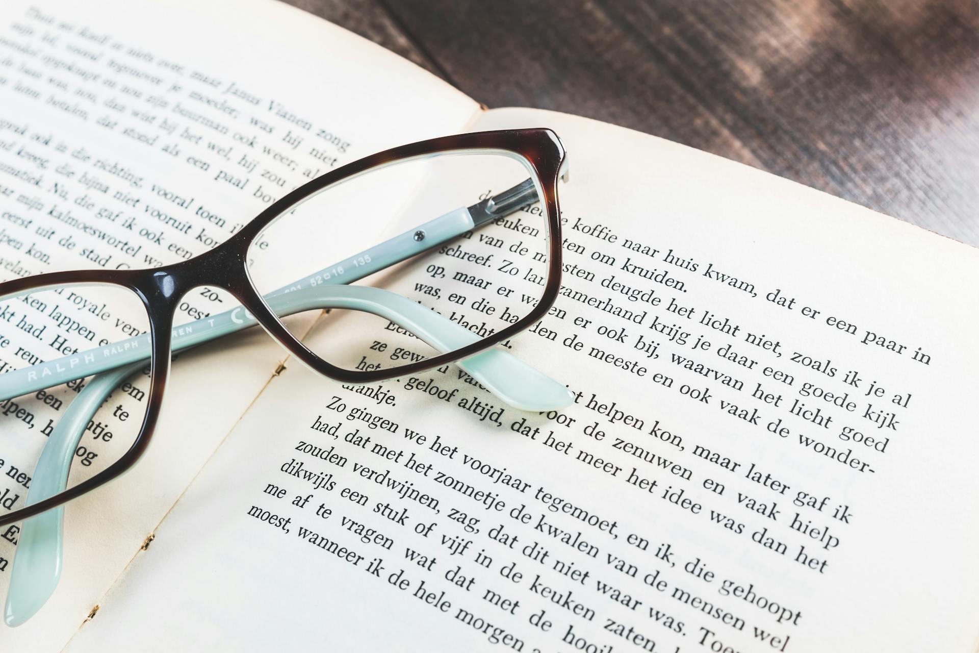 Reading glasses lying on a dutch book