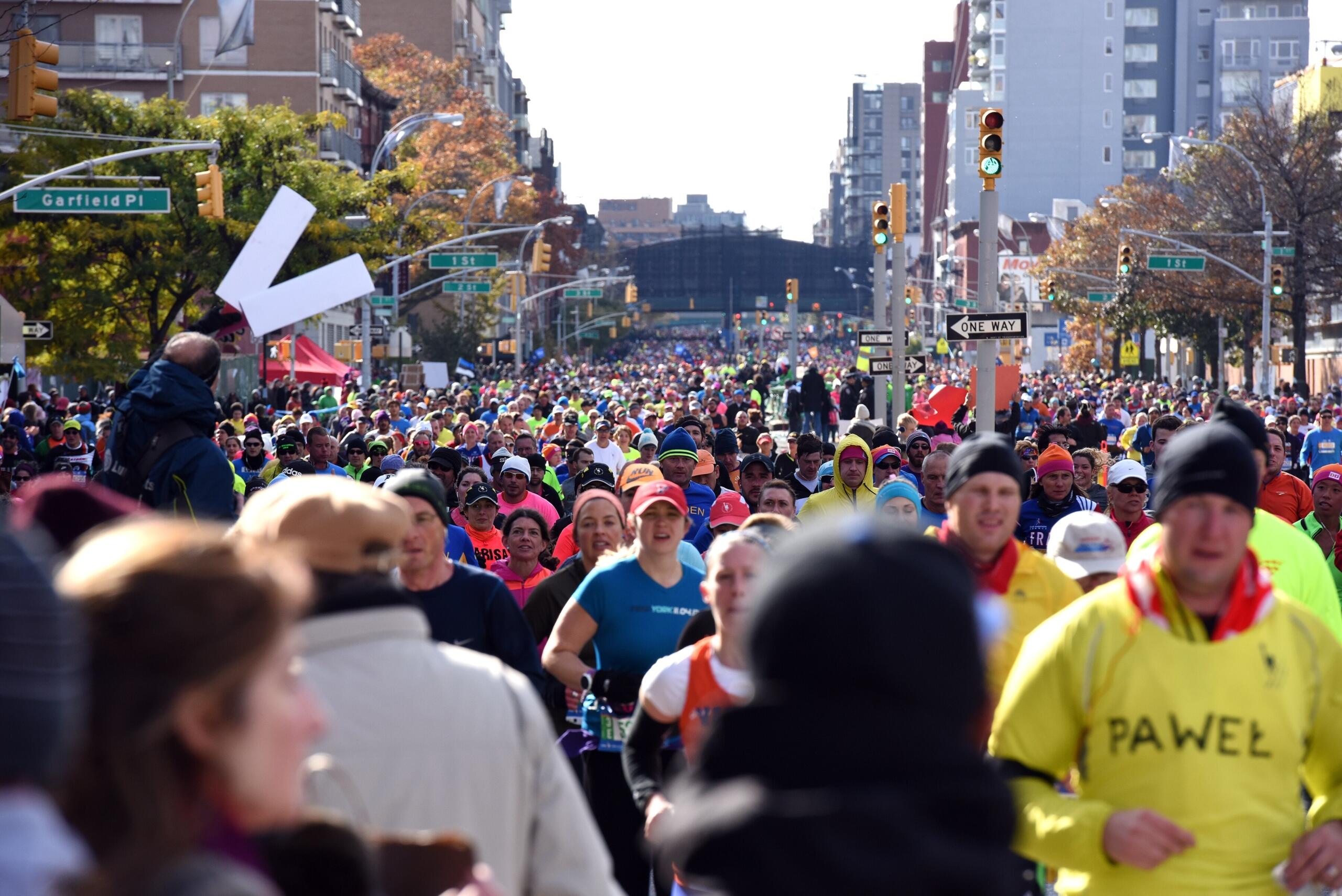 hundreds of runners and spectators along 4th Ave in Brooklyn