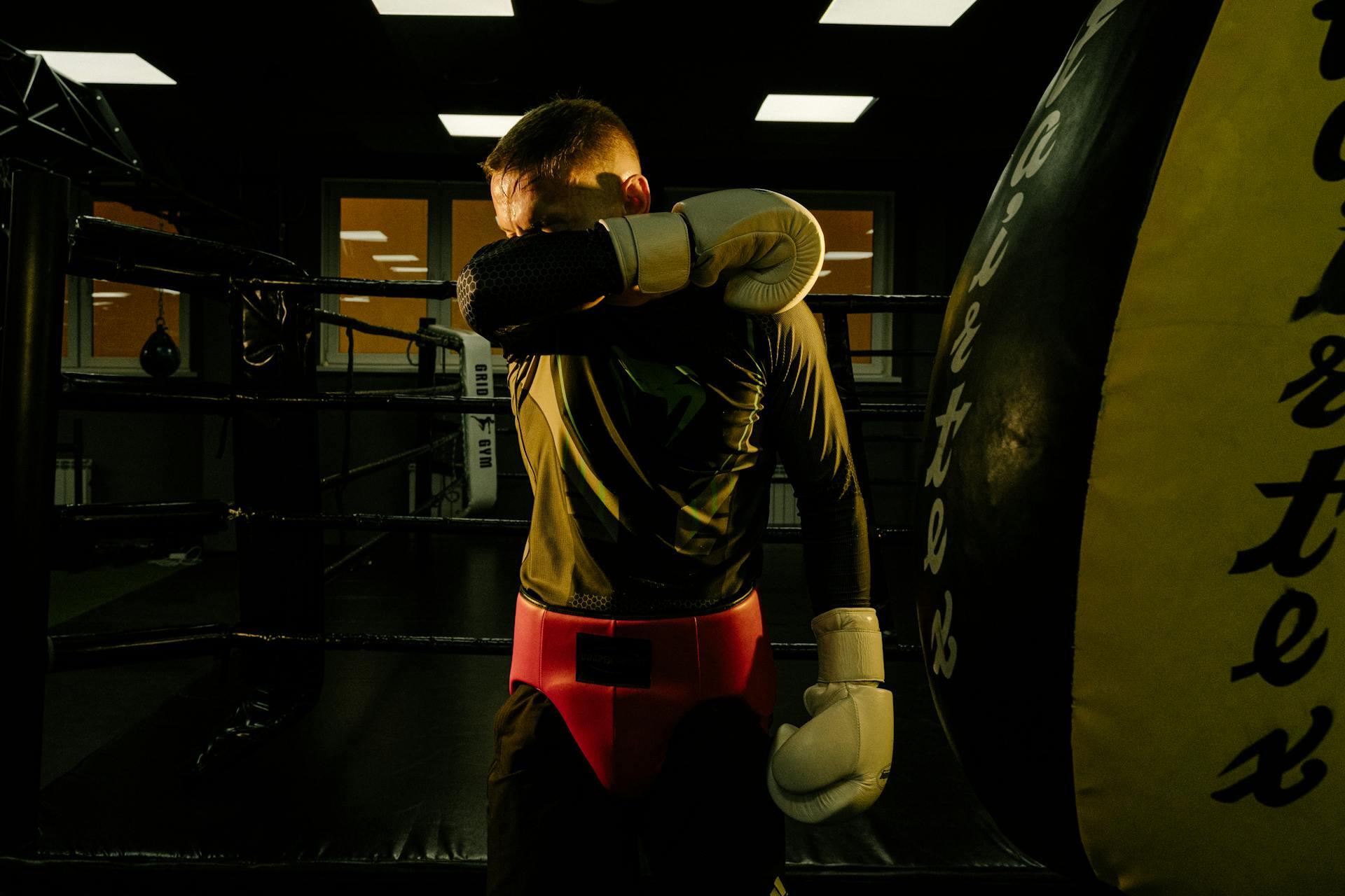 Boxer wiping sweat off face